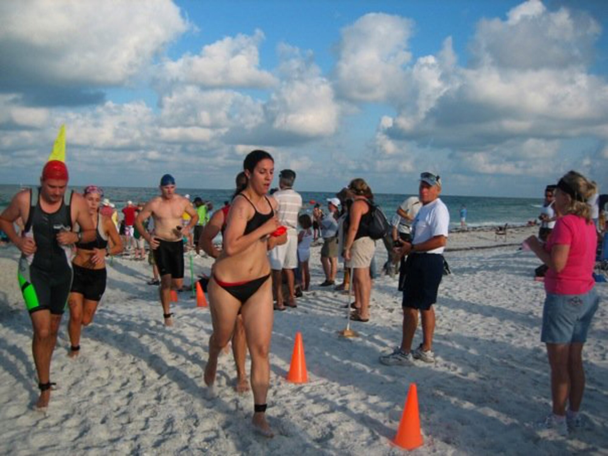Capt Andrea Erdekian of the 91st Air Refueling Squadron at Macdill Air Force Base finishing the 3.1 mile run in the final part of the Annual Dunedin Triathalon at Honeymoon Island on June 13, 2009.        
