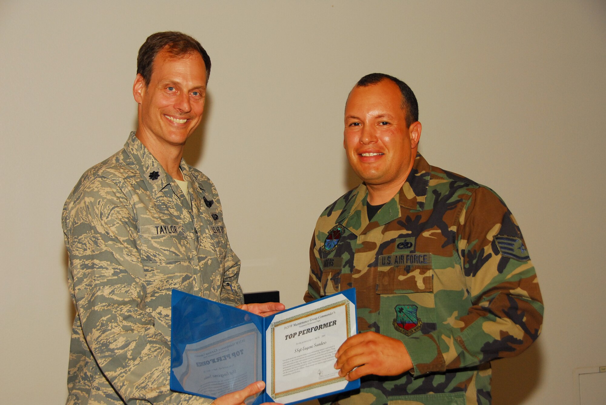 Staff Sgt. Eugene Sanders from the Equipment Maintenance Flight receives a Top Performer award, the first in a new quarterly award program for maintainers who go beyond expectations for quality and safety. (Air National Guard photo by Master Sgt. Dave Neve)