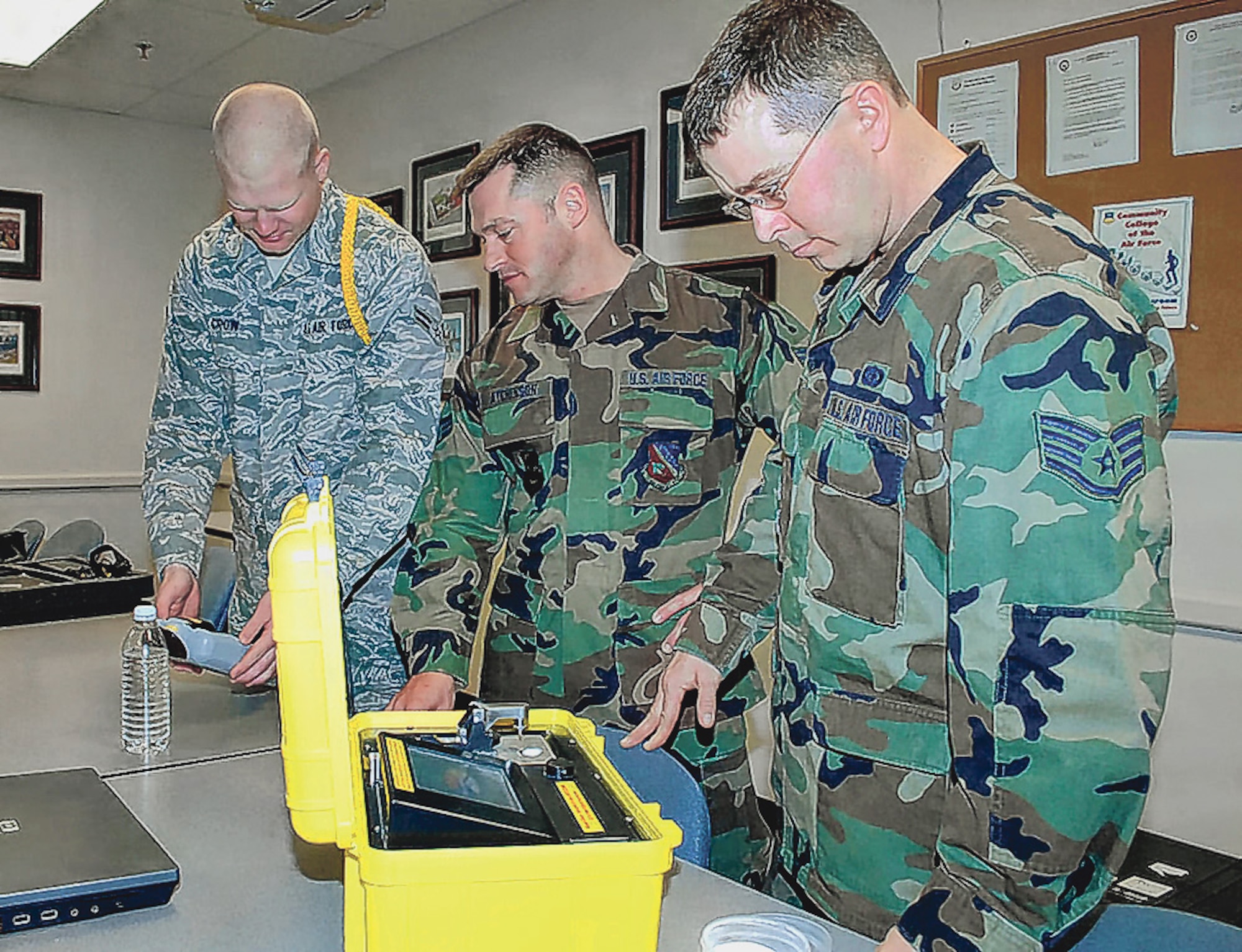 Airman 1st Class Jacob Crow, Senior Airman Adam Atchinson and Air Force Staff Sgt. Scott Sayer, all Class 09005, practice taking samples of non-evasive materials, April 10. During the Emergency Management Apprentice Course, Airmen are taught to plan for the worse and hope for the best when it comes to chemical, biological, radiological or nuclear situations. (U.S. Army photo)