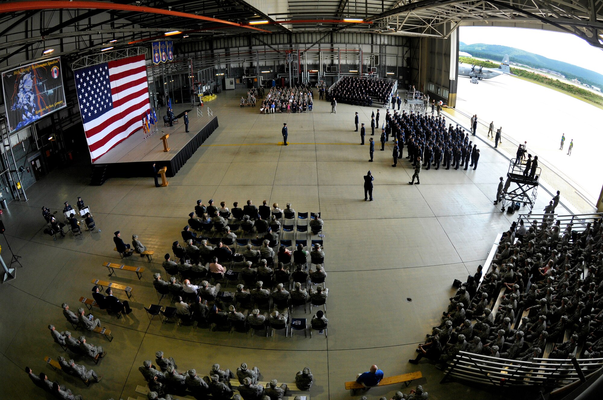 Members of Team Ramstein participate in the 435th Air Base Wing redesignation ceremony, Ramstein Air Base, Germany, July 16, 2009. During the ceremony, the 435th ABW was redesignated to the 435th AGOW, the first of its kind in U.S. Air Forces in Europe. (U.S. Air Force photo by Staff Sgt. Stephen J. Otero)