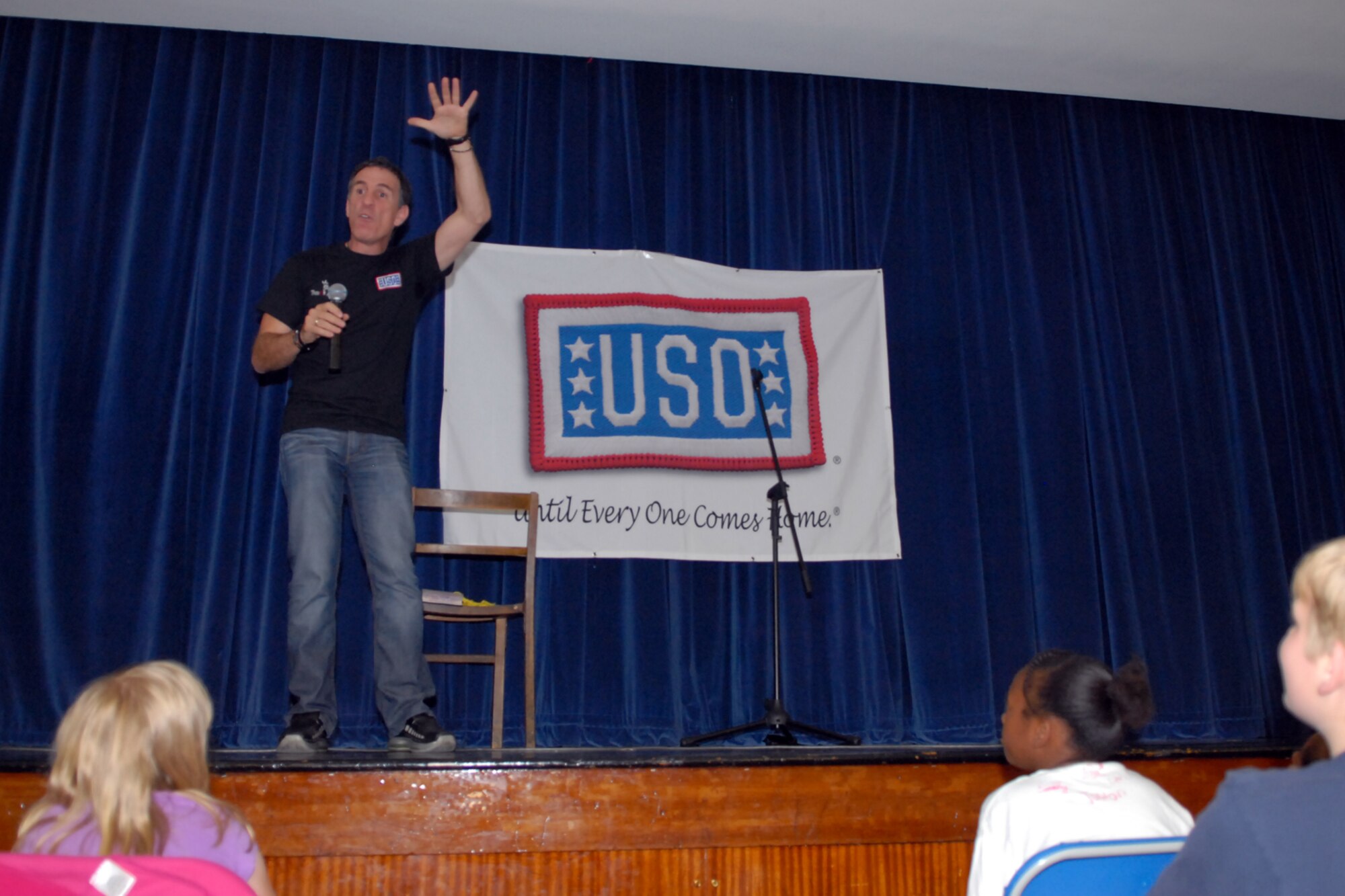 Trevor Romain, a children's comedian, entertains and educates children at the Bob Hope Center RAF Mildenhall about emotion, social and physical well being, July 11.  Mr. Romain draws his stories and jokes from his own childhood experiences growing up in South Africa.  (U.S. Air Force photo by Staff Sgt. Christopher L. Ingersoll)