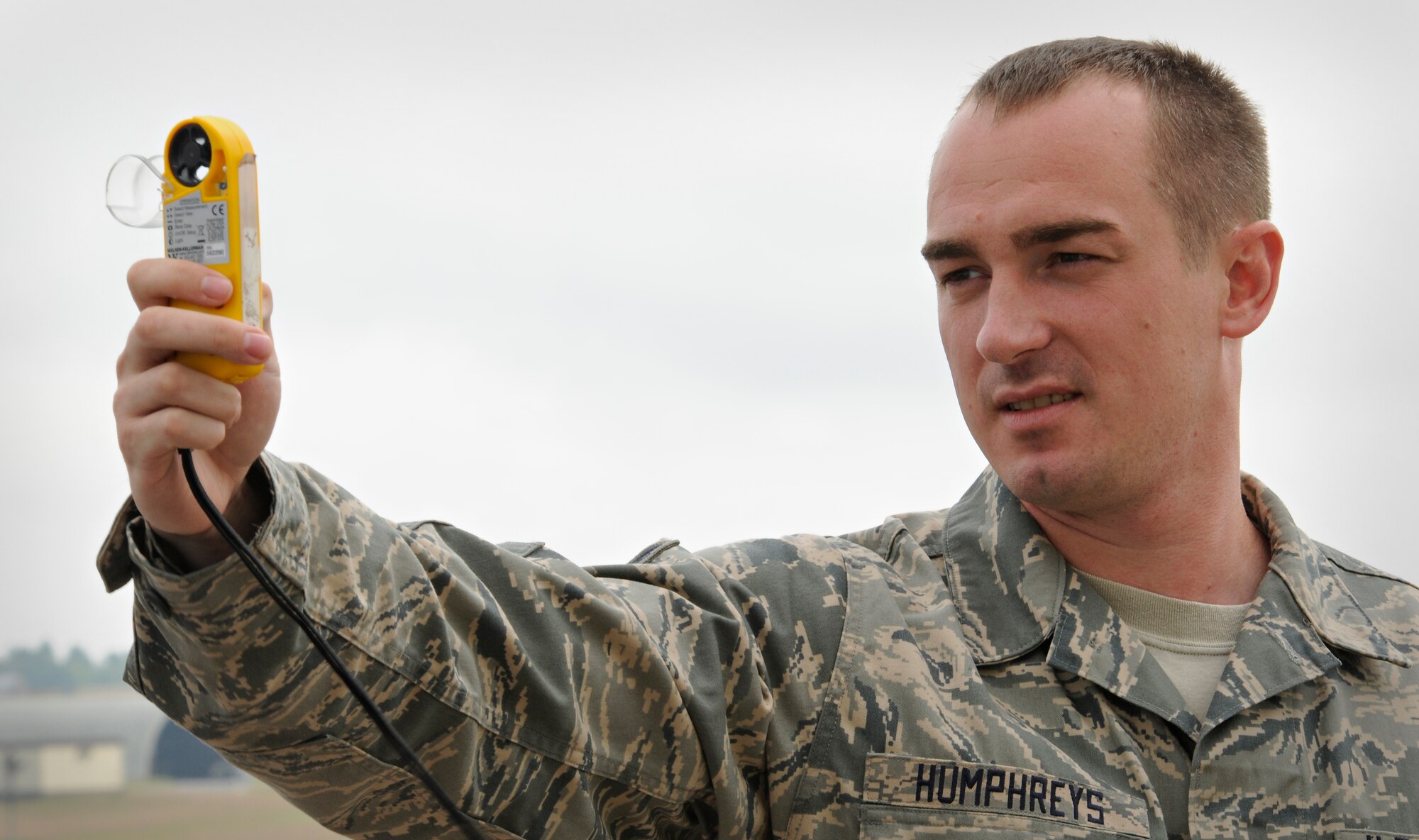SPANGDAHLEM AIR BASE, Germany – Tech. Sgt. Michael Humphreys, 52nd Operations Support Squadron mission weather forecaster, monitors wind speed and visibility using a Kestrel 4500 hand-held weather gauge just off of Spangdahlem Air Base’s flight line July 14. As a member of the weather flight Sergeant Humphrey provides a range of services including satellite analysis, lightning data, radar analysis, divert base support and mission execution forecasts through the “Eyes Forward” concept with the 21st Operational Weather Squadron, located at Sembach Air Base, Germany. (U.S. Air Force photo by Senior Airman Benjamin Wilson)