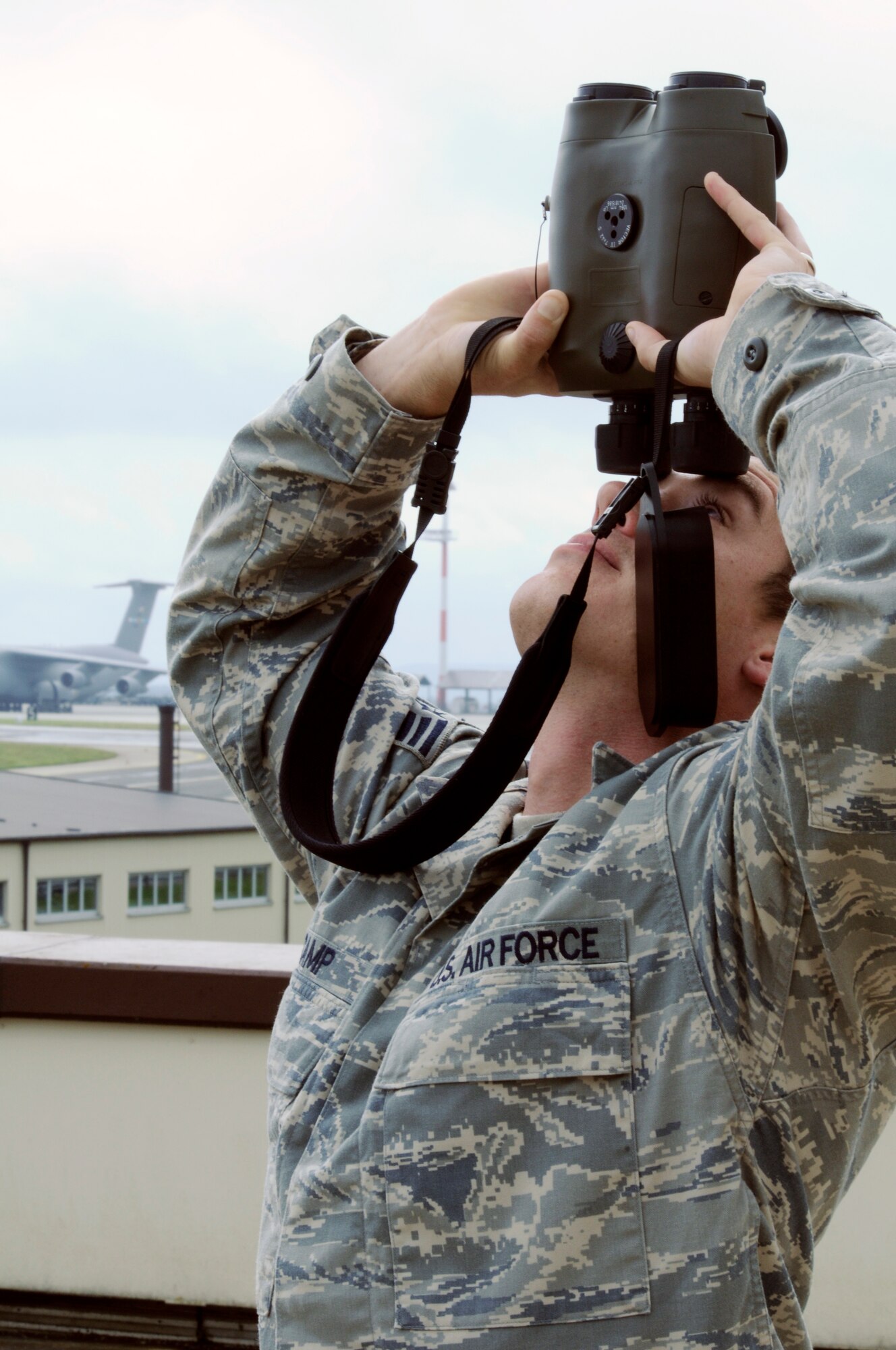 SPANGDAHLEM AIR BASE, Germany – Staff Sgt. Andrew Camp, 52nd Operations Support Squadron mission weather forecaster, uses a set of laser range finders to determine the height of the cloud ceiling July 14. As a member of the weather flight Sergeant Camp provides a range of services including satellite analysis, lightning data, radar analysis, divert base support and mission execution forecasts through the “Eyes Forward” concept with the 21st Operational Weather Squadron, located at Sembach Air Base, Germany. (U.S. Air Force photo By Senior Airman Benjamin Wilson)
