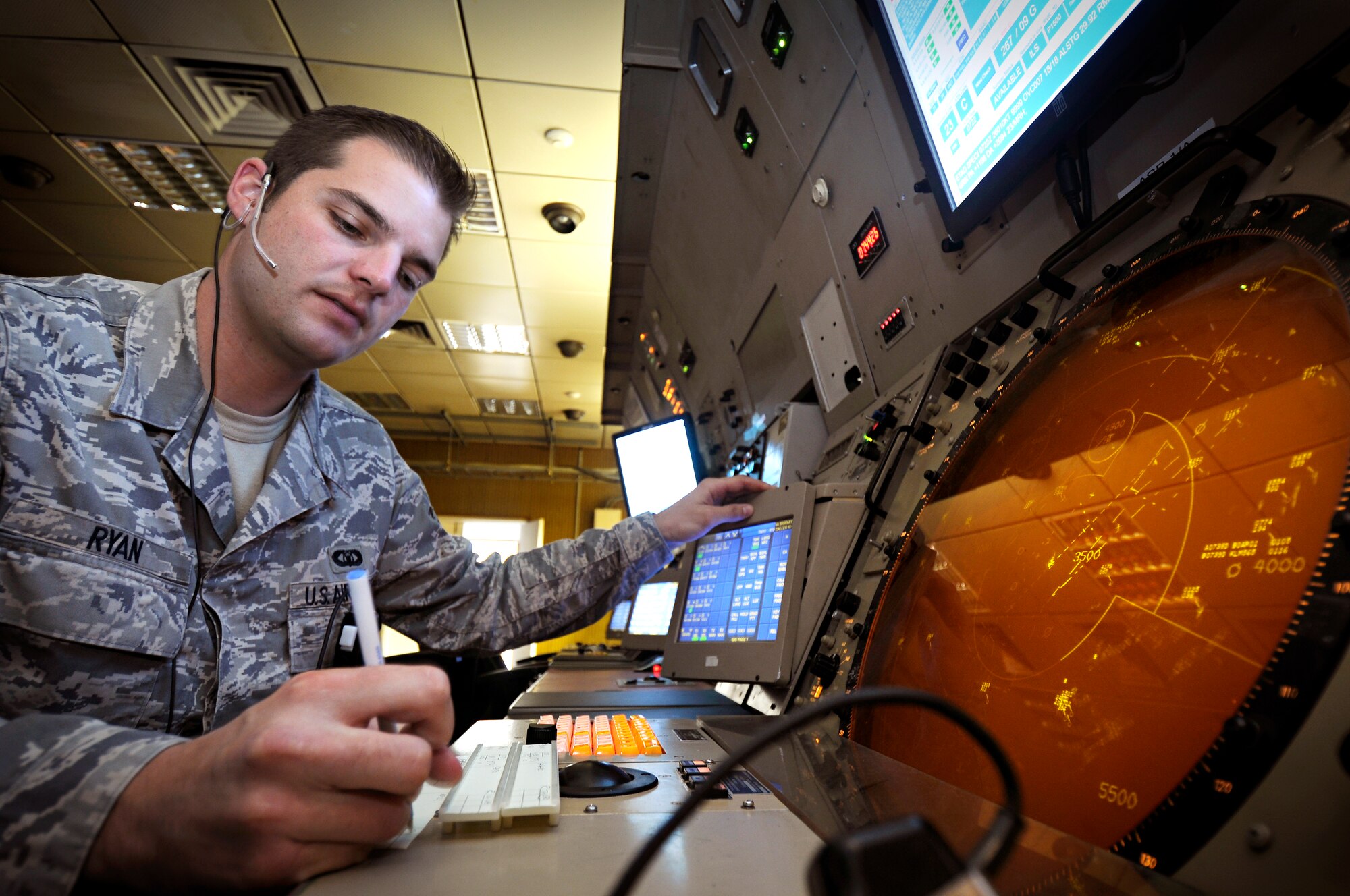 SPANGDAHLEM AIR BASE, Germany – Senior Airman Mike Ryan, 52nd Operations Support Squadron air traffic controller, works in the ground controlled approach area coordinating with Spangdahlem Air Base’s air traffic control tower and German agencies for the release of aircraft to takeoff July 14. Airman in the airfield operations flight are responsible for the airfield environment including oversight of Spangdahlem’s runway, parallel taxiway and six operational ramps, totaling more than 7 million square feet of airfield pavement. (U.S. Air Force photo by Senior Airman Benjamin Wilson)