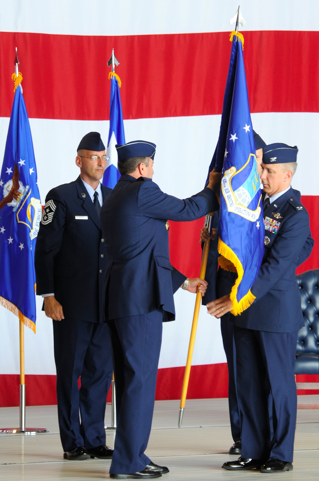 U.S. Air Force Col. Thomas F. Gould, 435th Air Ground Operations Wing commander, receives the guidon from U.S. Air Force Lt. Gen. Philip M. Breedlove, 3rd Air Force commander, during the 435th Air Base Wing redesignation ceremony, Ramstein Air Base, Germany, July 16, 2009. During the ceremony, the 435th ABW was redesignated to the 435th AGOW, the first of its kind in U.S. Air Forces in Europe. (U.S. Air Force photo by Tech. Sgt. Kenneth Bellard)