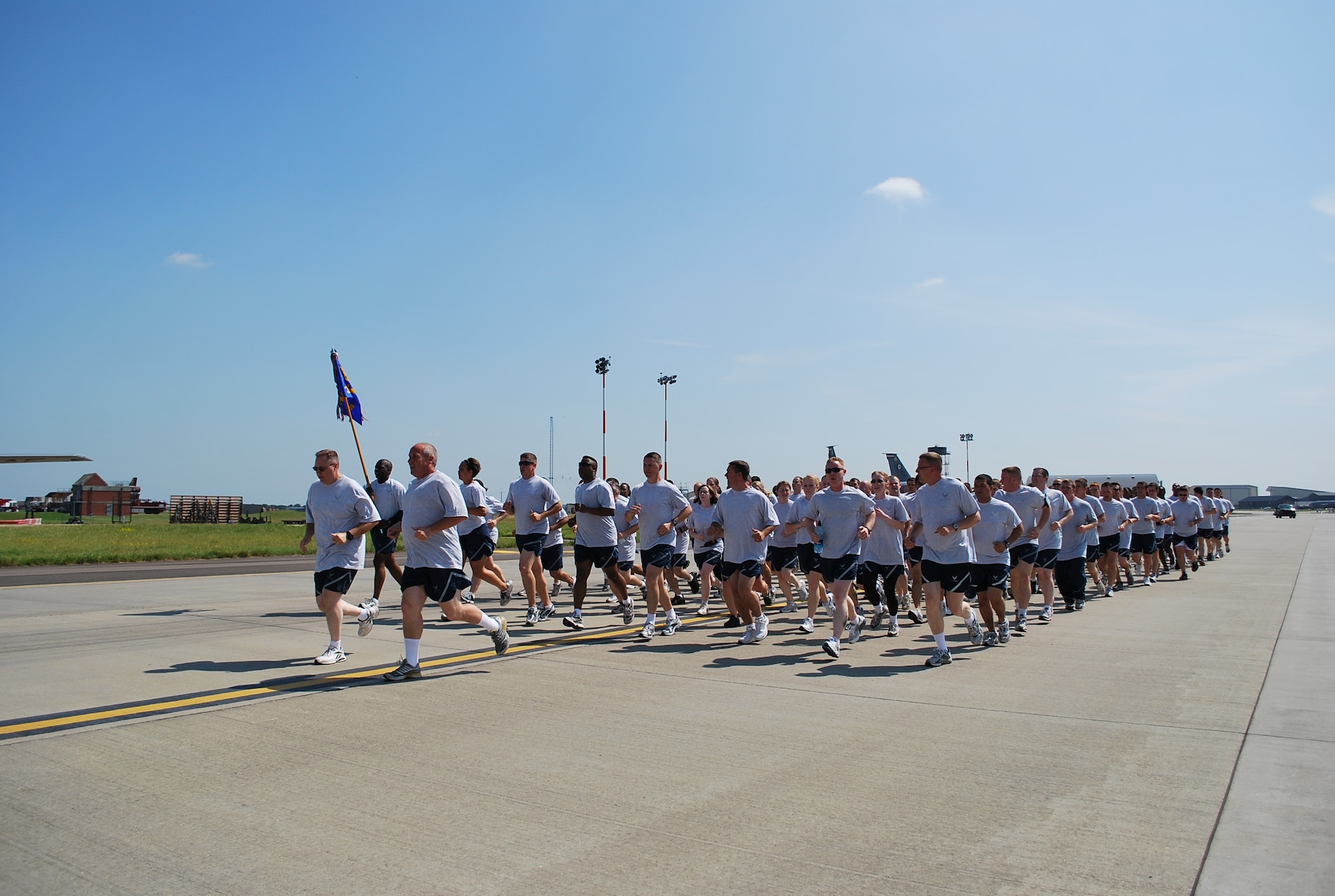 One hundred and eighty four members of the 352nd Maintenance Squadron set off on a two-mile run on the base taxiway as part of the squadron's recent fitness and sports day. Setting the pace is Lt. Col. Dean Judge, 352nd MXS commander (front left) and Chief Master Sgt. Greg Terry, 352nd MXS superintendent. (U.S. Air Force photo by Airman 1st Class Amanda Ryzenga)
