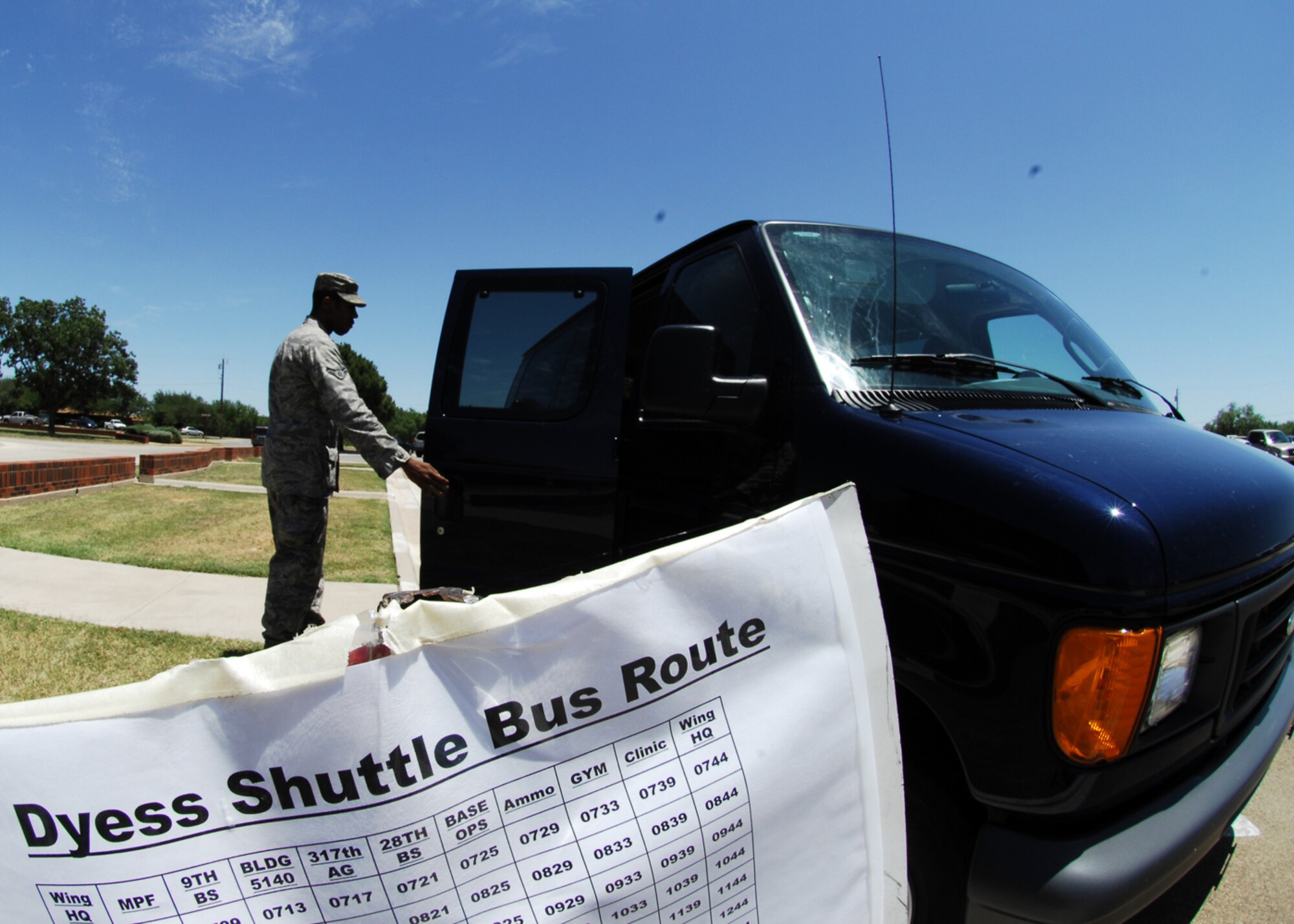 Airman 1st Class JaCorey Richards, 7th Logistics Readiness Squadron, boards the shuttle July 15 outside the 7th Bomb Wing headquarters building. The readiness squadron will provide the shuttle service as part of a 30-day trial. After 30 days, the squadron will conduct analyses to determine if the service is valid and if any adjustments to routes or schedules should be made. The bus schedule can be found at www.dyess.af.mil.(U.S. Air Force photo by Airman 1st Class Chelsea L. White) 
