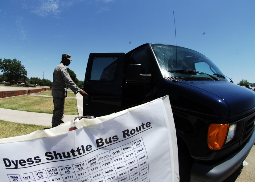 Airman 1st Class JaCorey Richards, 7th Logistics Readiness Squadron, boards the shuttle July 15 outside the 7th Bomb Wing headquarters building. The readiness squadron will provide the shuttle service as part of a 30-day trial. After 30 days, the squadron will conduct analyses to determine if the service is valid and if any adjustments to routes or schedules should be made. The bus schedule can be found at www.dyess.af.mil.(U.S. Air Force photo by Airman 1st Class Chelsea L. White) 
