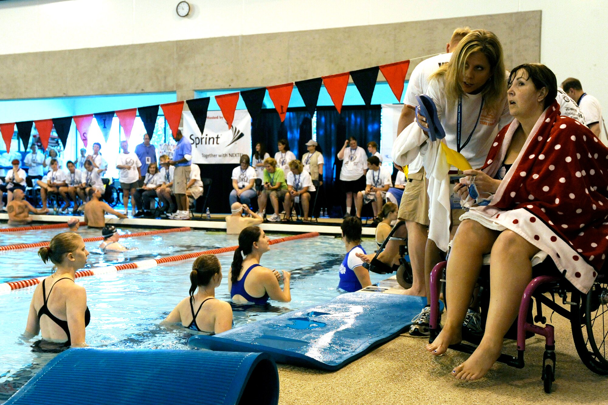 Terri Fuda and Amy Will look at the score board after Ms. Fuda completed her race in the swimming competition held at the Whitworth University swimming pool during the 29th National Veterans Wheelchair Games July 15 in Spokane, Wash. Ms. Fuda is an Air Force veteran from Gillespie, Ill. Ms. Will is a recreation therapist from St. Louis. (U.S. Air Force photo/Staff Sgt. Desiree N. Palacios)