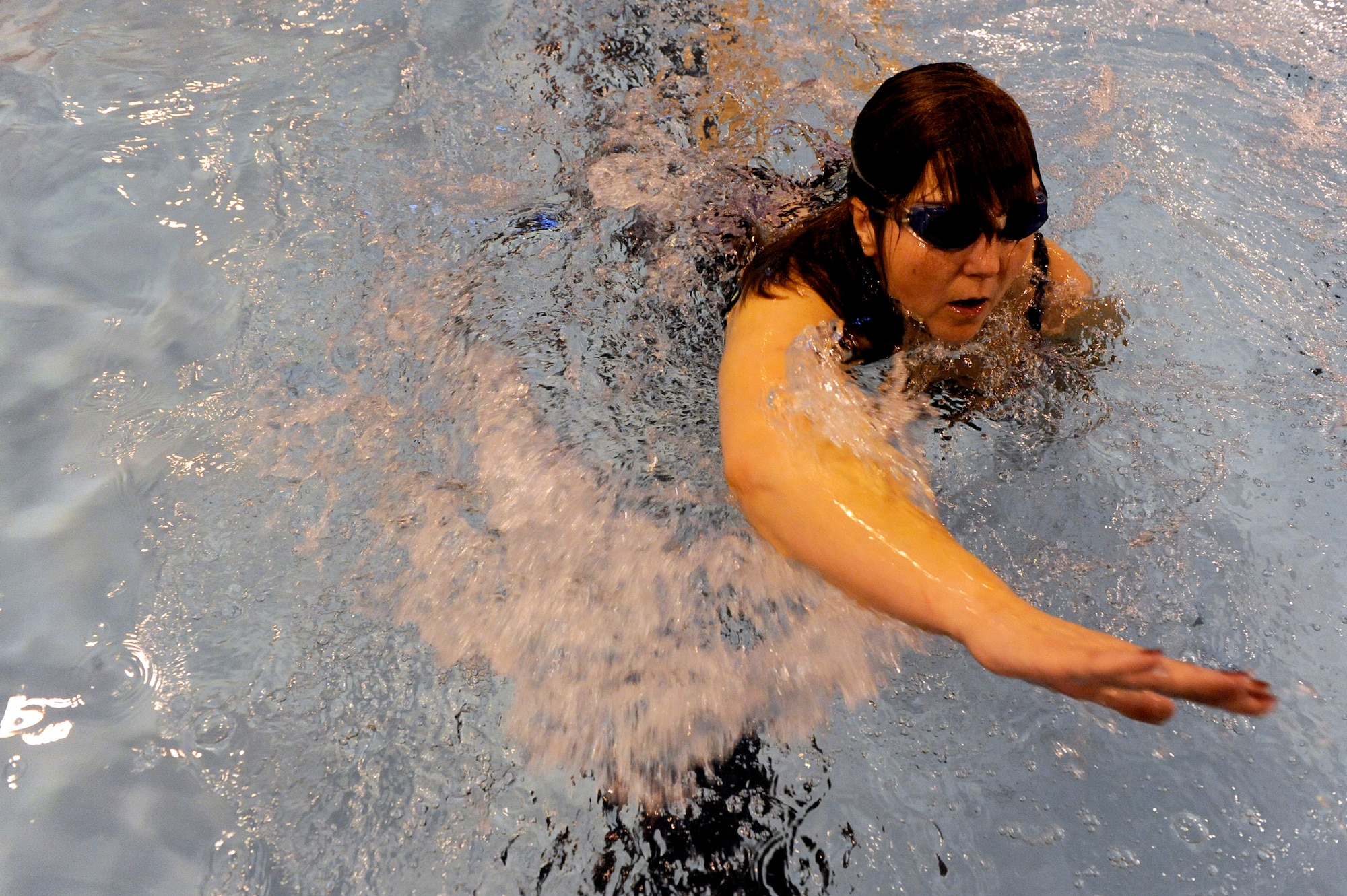 Terri Fuda swims as she competes in the swimming competition held at the Whitworth University swimming pool during the 29th National Veterans Wheelchair Games July 15 in Spokane, Wash. Ms. Fuda is an Air Force veteran from Gillespie, Ill.  (U.S. Air Force photo/Staff Sgt. Desiree N. Palacios)