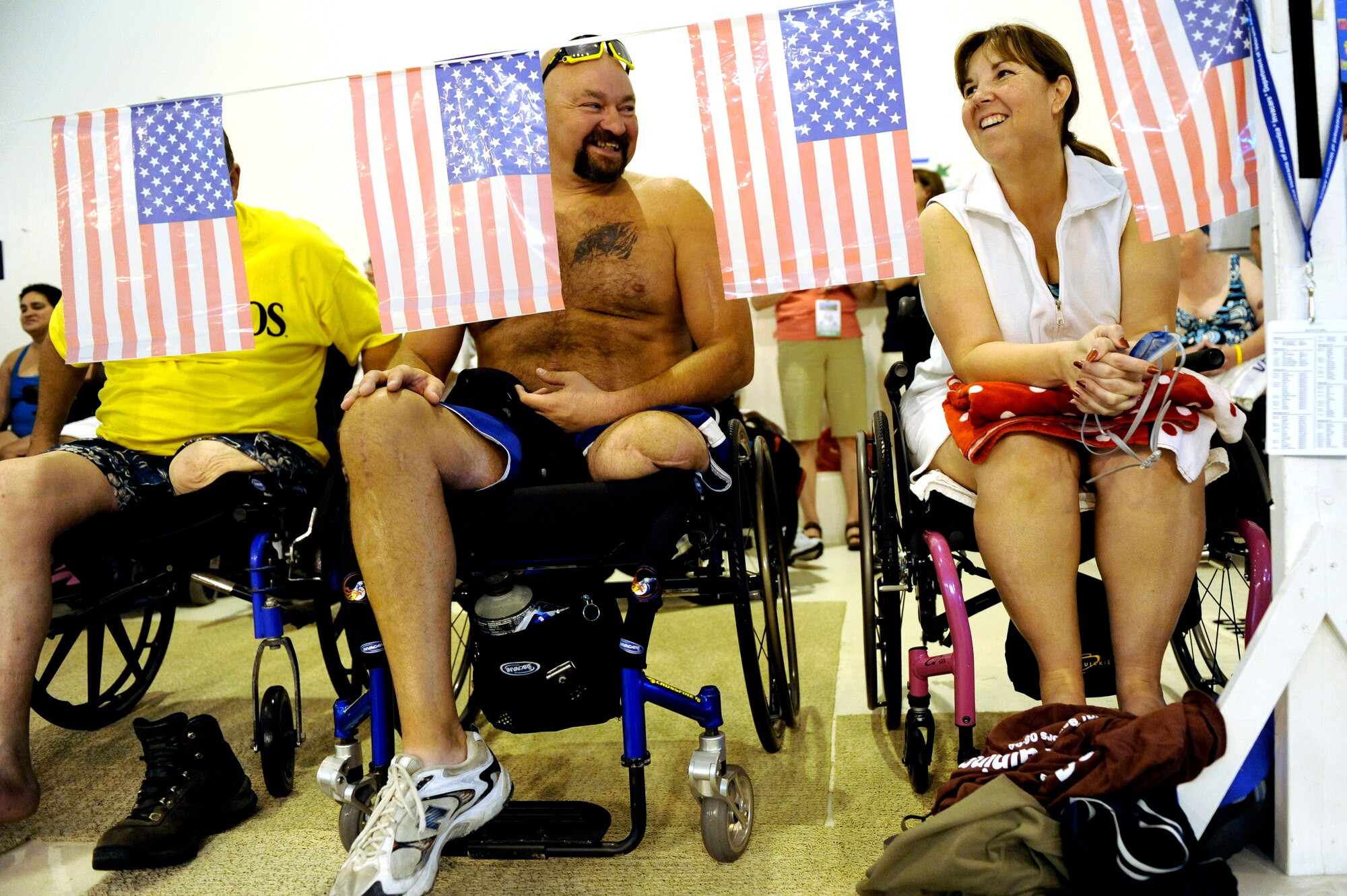 Dave Nelson and Terri Fuda laugh as they wait their turn to compete in the swimming competition held at the Whitworth University swimming pool during the 29th National Veterans Wheelchair Games July 15 in Spokane, Wash. Ms. Fuda is an Air Force veteran from Gillespie, Ill. and Mr. Nelson is a Navy veteran from Omaha, Neb. The 29th National Veterans Wheelchair Games runs through Julu 19. (U.S. Air Force photo/Staff Sgt. Desiree N. Palacios)