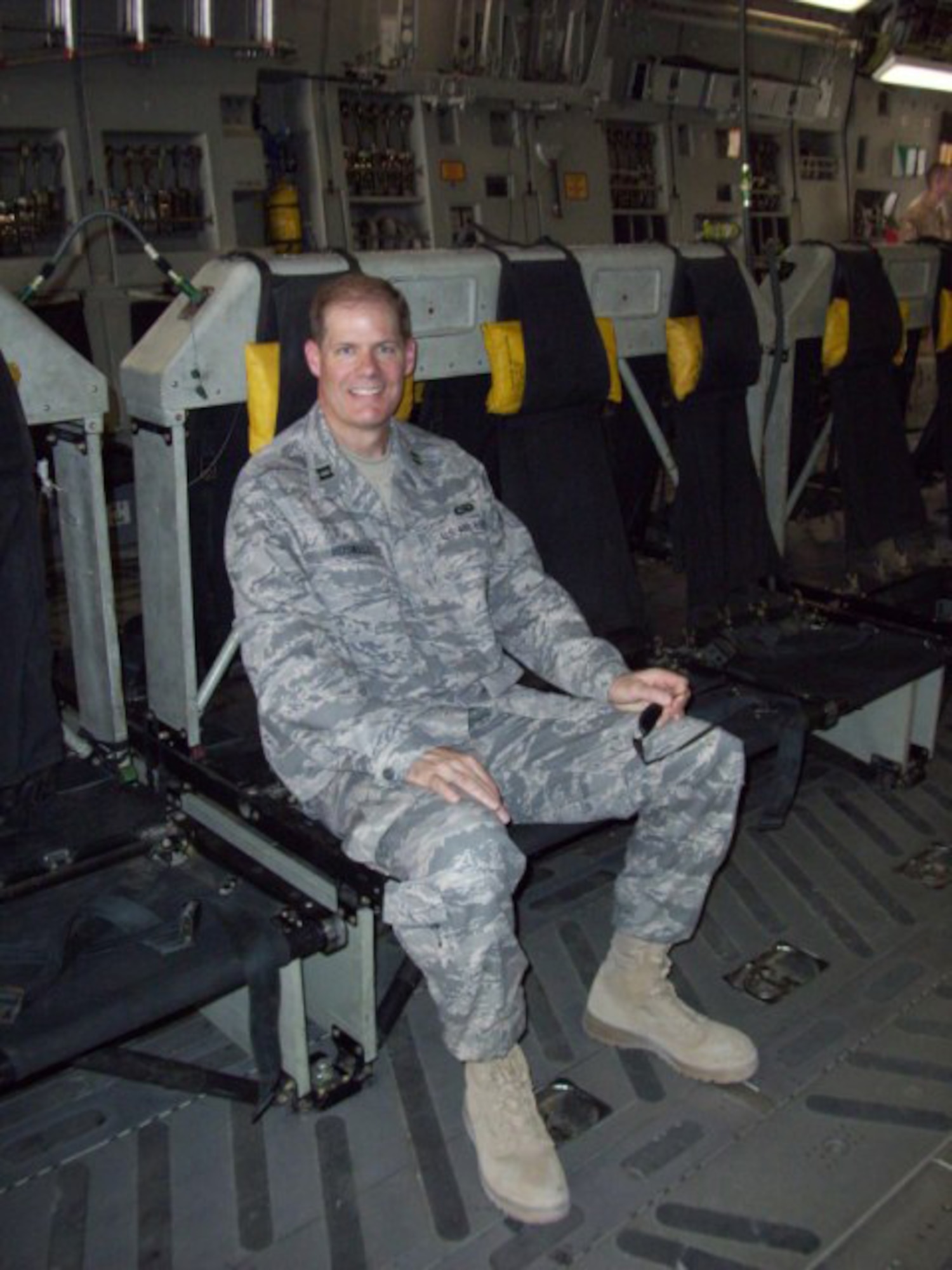 SEYMOUR JOHNSON AIR FORCE BASE, N.C. -- Capt. Marc Boswell sits aboard a C-17 Globemaster bound for Al Udeid, Qatar.  Capt. Boswell is the 916th Communication Squadron operations officer and is currently deployment to the Middle East.