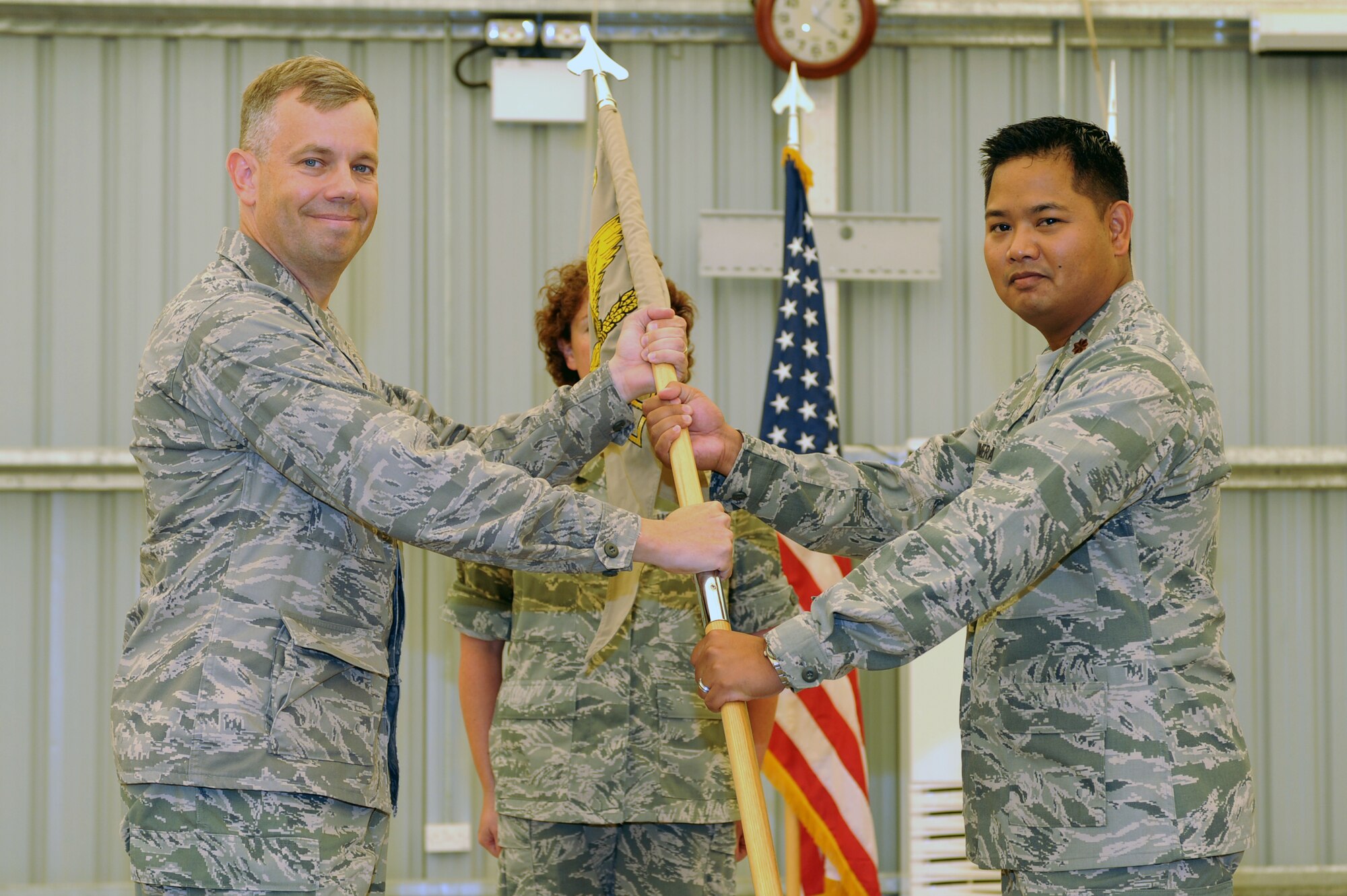 SOUTHWEST ASIA – Maj. David Sumera, 380th Expeditionary Communications Squadron commander, accepts the guidon during the change of command ceremony July 15. Major Sumera was previously assigned to Maxwell Air Force Base where he was a student at Air Command and Staff College. (U.S. Air Force photo/Tech. Sgt. Charles Larkin Sr) 