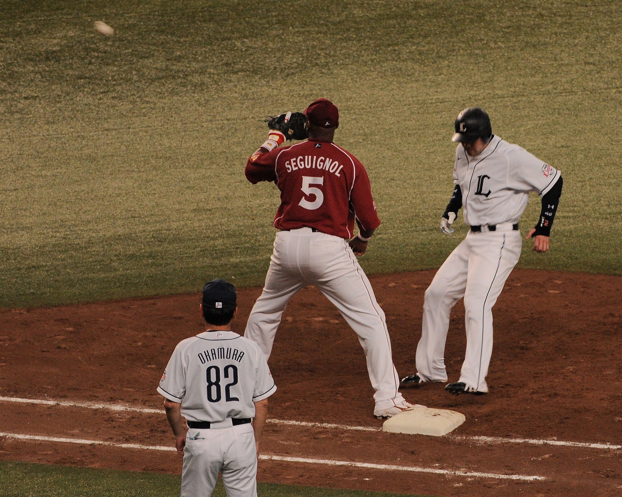 TOKOROZAWA, Japan --  Saitama Seibu Lions outfielder Takahiko Sato hustles back to the bag on a pick-off attempt during Japanese Baseball League action July 14 vs. the Tohoku Rakuten Golden Eagles at the Seibu Dome. The Musashimurayama Yokota Friendship Club treated members of the 374th Operations Group to the game. The club hosts several events throughout the year to strengthen the relationship between the two communities. (U.S. Air Force photo/Airman 1st Class Michael Dillon)

