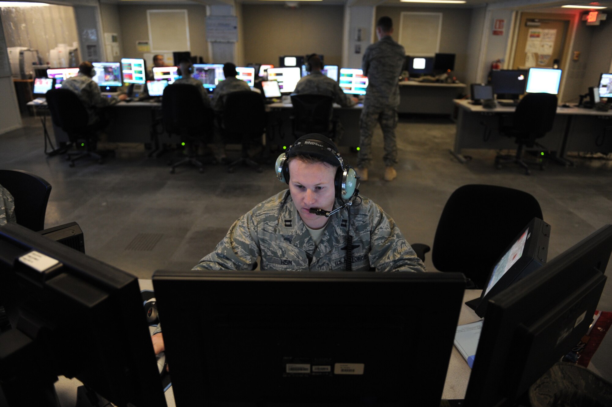 Capt. Owen Hein, 71st Expeditionary Air Control Squadron air weapons officer, directs both support and combat aircraft into target areas, July 13, in Southwest Asia. The 71 EACS provides around-the-clock air defense and air battlespace management of the area of responsibility. Captain Hein, a native of Roswell, N.M., is deployed from Tinker Air Force Base, Okla., in support of Operations Iraqi and Enduring Freedom. (U.S. Air Force Photo/Staff Sgt. Robert Barney) 