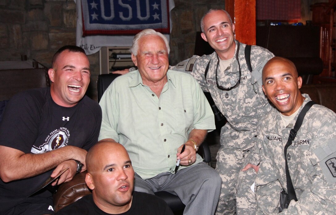 Former Miami Dolphins head coach Don Shula, center, poses for a photo with a group of servicemembers at the Pat Tillman USO on Bagram Airfield, Afghanistan, July 15, 2009. U.S. Army photo by Capt. Michael Greenberger 