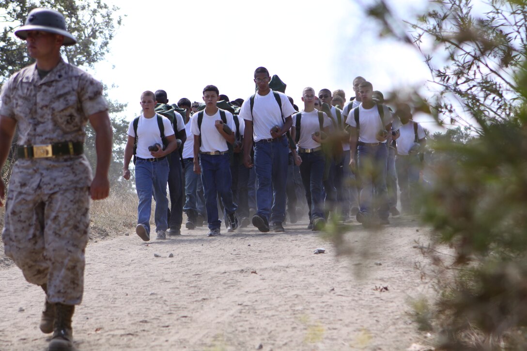 Sgt. Matthew Emmerich,  volunteer Devil Pups instructor with Combat Logistics Regiment 17, Communications Company, walks new recruits to their bivouac areas during the first day of the Devil Pups Program on Camp Pendleton, July 16.
