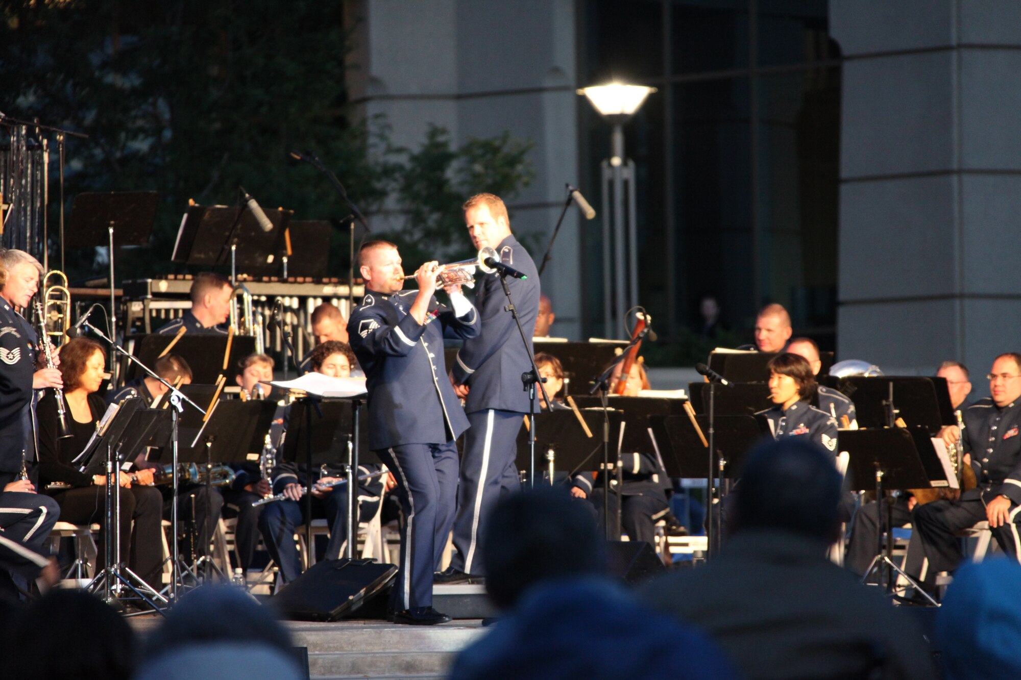 1Lt Jason Plosch conducts while MSgt Tim Allums performs “The Music of Louis Armstrong” in Aurora, CO