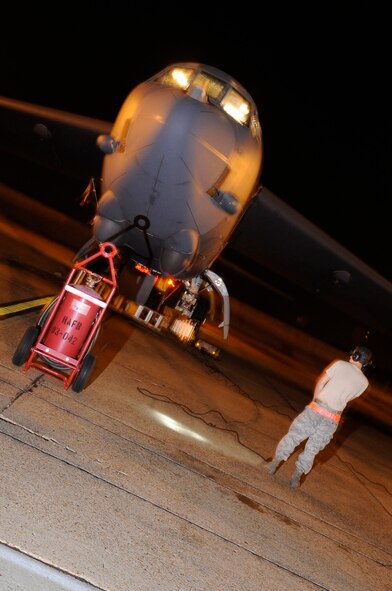 Airman 1st Class Daniel Gonzalez, a B-52 crew chief with the 2d  Maintenance Squadron, conducts an engine run during a Conventional Operational Readiness Exercise (CORE).  The CORE was the fourth of the year for Barksdale and tests readiness and deployability of base assets and personnel, Jul. 12.  (U.S. Air Force photo by Tech. Sgt. Laura K. Deckman)(released)