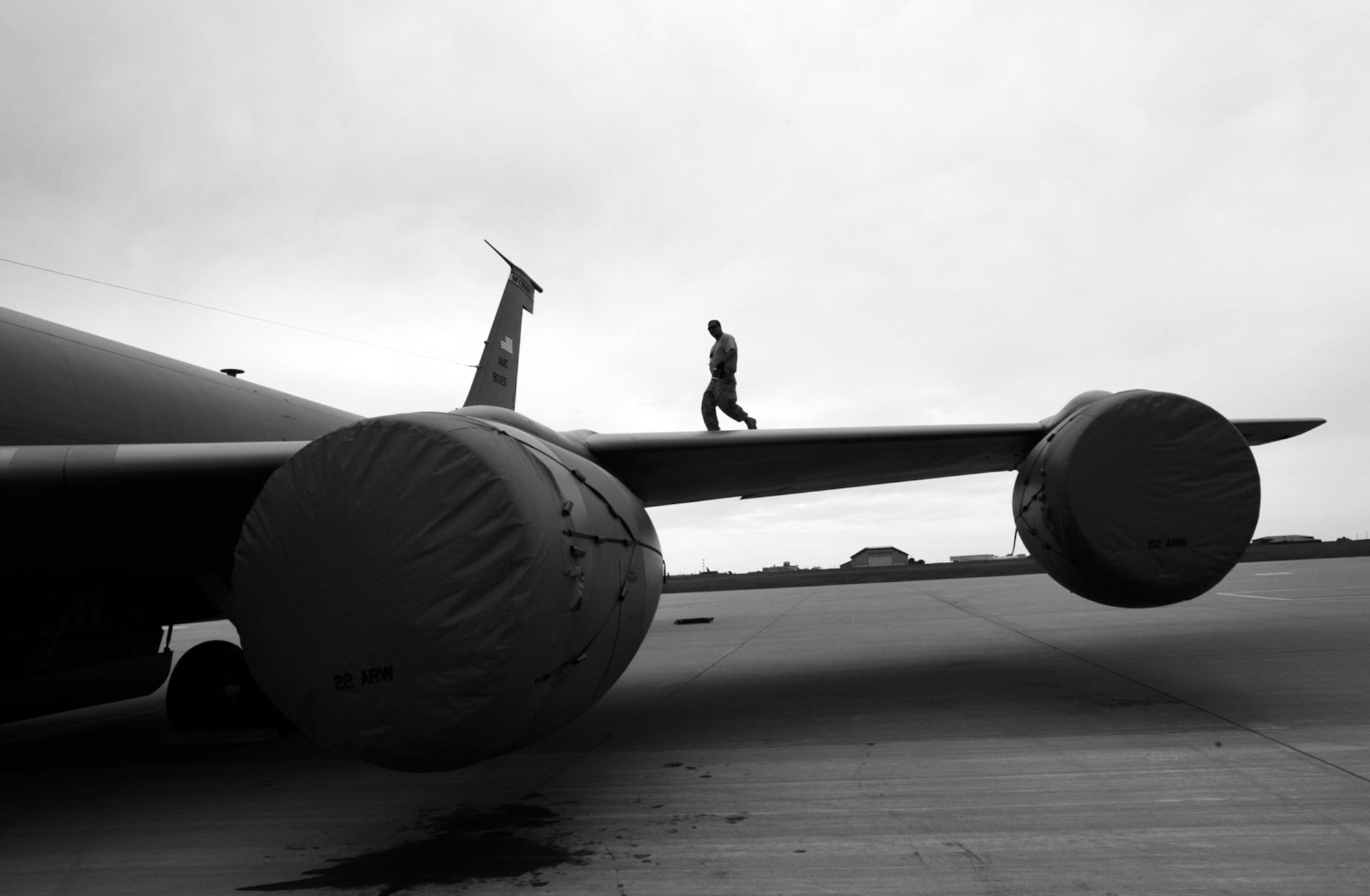 Tech. Sgt. Billy Martin walks across the wing of a KC-135 Stratotanker Friday at McConnell Air Force Base, Kan., after finishing some final preparations for Air Mobility Command Rodeo 2009. Sergeant Martin, a Reservist assigned to the 931st Aircraft Maintenance Squadron, is part of a total-force team of Reservists and active-duty Airmen scheduled to depart for Rodeo 2009 on July 18. (U.S. Air Force photo/Tech. Sgt. Jason Schaap) 