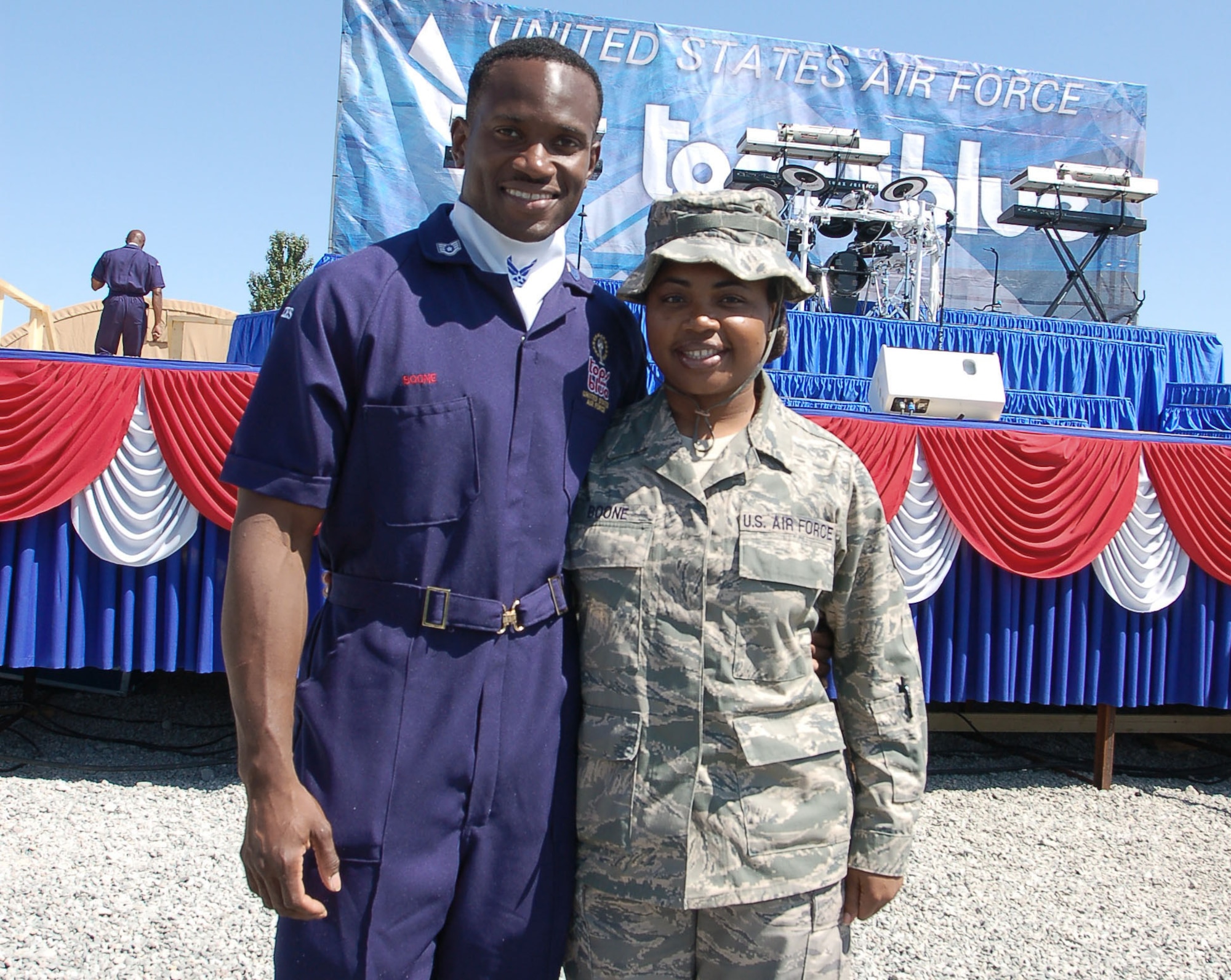 Tech. Sgt. Patrika Boone reunites with her husband Staff Sgt. Wendell Boone Jr., a vocalist with Tops In Blue, during the Air Force Expeditionary Entertainers' visit to the Transit Center July 10 at Manas Air Base, Kyrgyzstan. During the visit, Tops In Blue performed two shows at Manas AB. Sergeant Boone, assigned to the 376th Expeditionary Logistics Readiness Squadron here, is deployed from Robins Air Force Base, Ga., while her husband is an air transportation apprentice with the 69th Aerial Port Squadron at Andrews AFB, Md. (U.S. Air Force photo/Staff Sgt. Olufemi Owolabi)