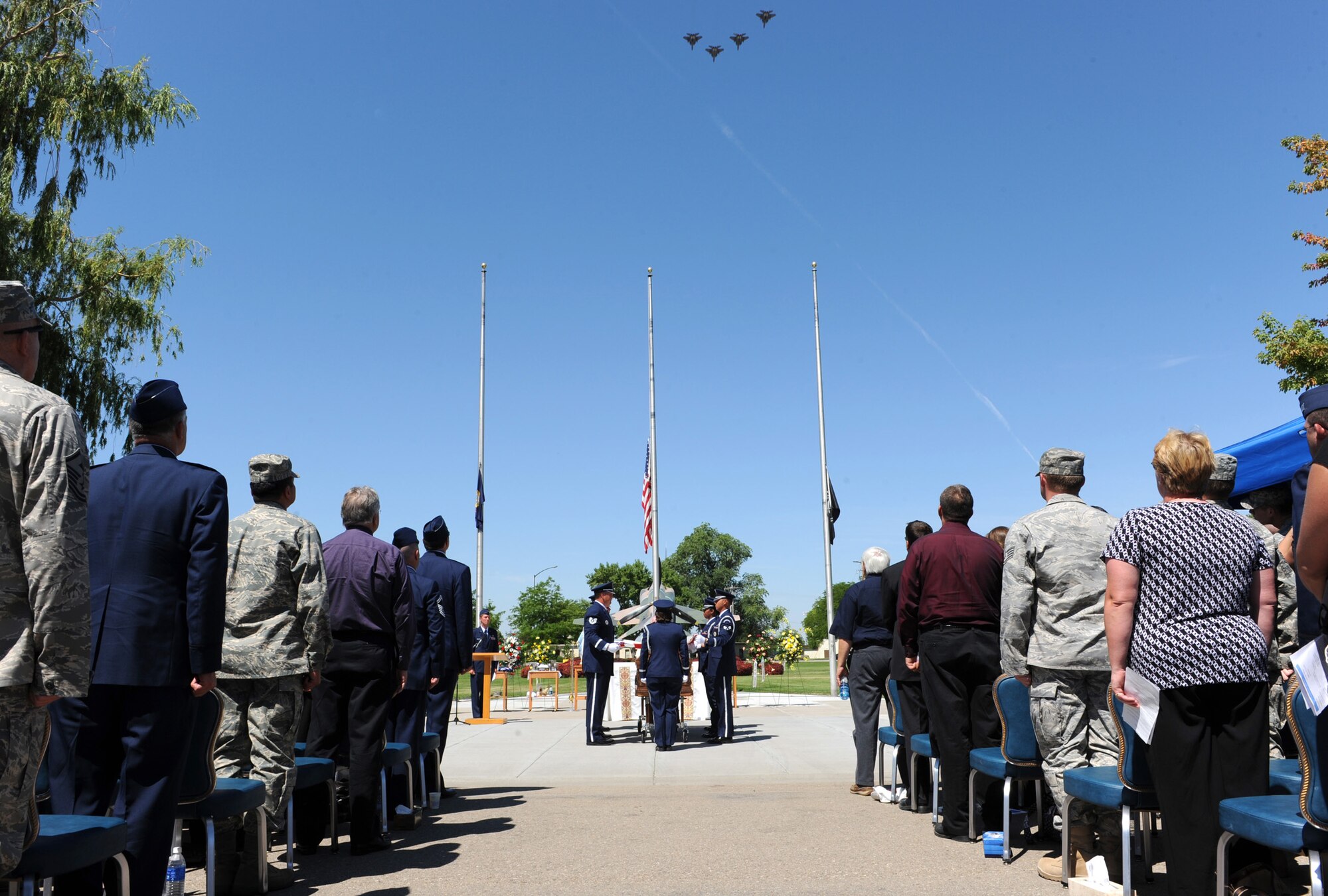 MOUNTAIN HOME AIR FORCE BASE, Idaho – The 389th Fighter Squadron performs a mission man flyover during a memorial service for Capt. Mark Zampogna, who died July 11 when he was removed from medical life support equipment, down the aisle during a memorial service at Holt Park July 17. The captain, from the 366th Operations Support Squadron, had been at St. Alphonsus Hospital in Boise, Idaho, in critical condition since July 6 after he was severely injured in a vehicle accident near McCall, Idaho. (U.S. Air Force photo by Airman 1st Class Debbie Lockhart)