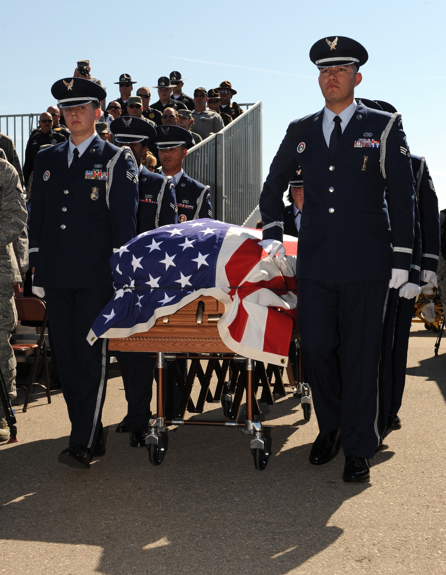 MOUNTAIN HOME AIR FORCE BASE, Idaho – The Mountain Home Air Force Base Honor Guard marches the casket of Capt. Mark Zampogna, who died July 11 when he was removed from medical life support equipment, down the aisle during a memorial service at Holt Park July 17. The captain, from the 366th Operations Support Squadron, had been at St. Alphonsus Hospital in Boise, Idaho, in critical condition since July 6 after he was severely injured in a vehicle accident near McCall, Idaho. (U.S. Air Force photo by Airman 1st Class Debbie Lockhart)