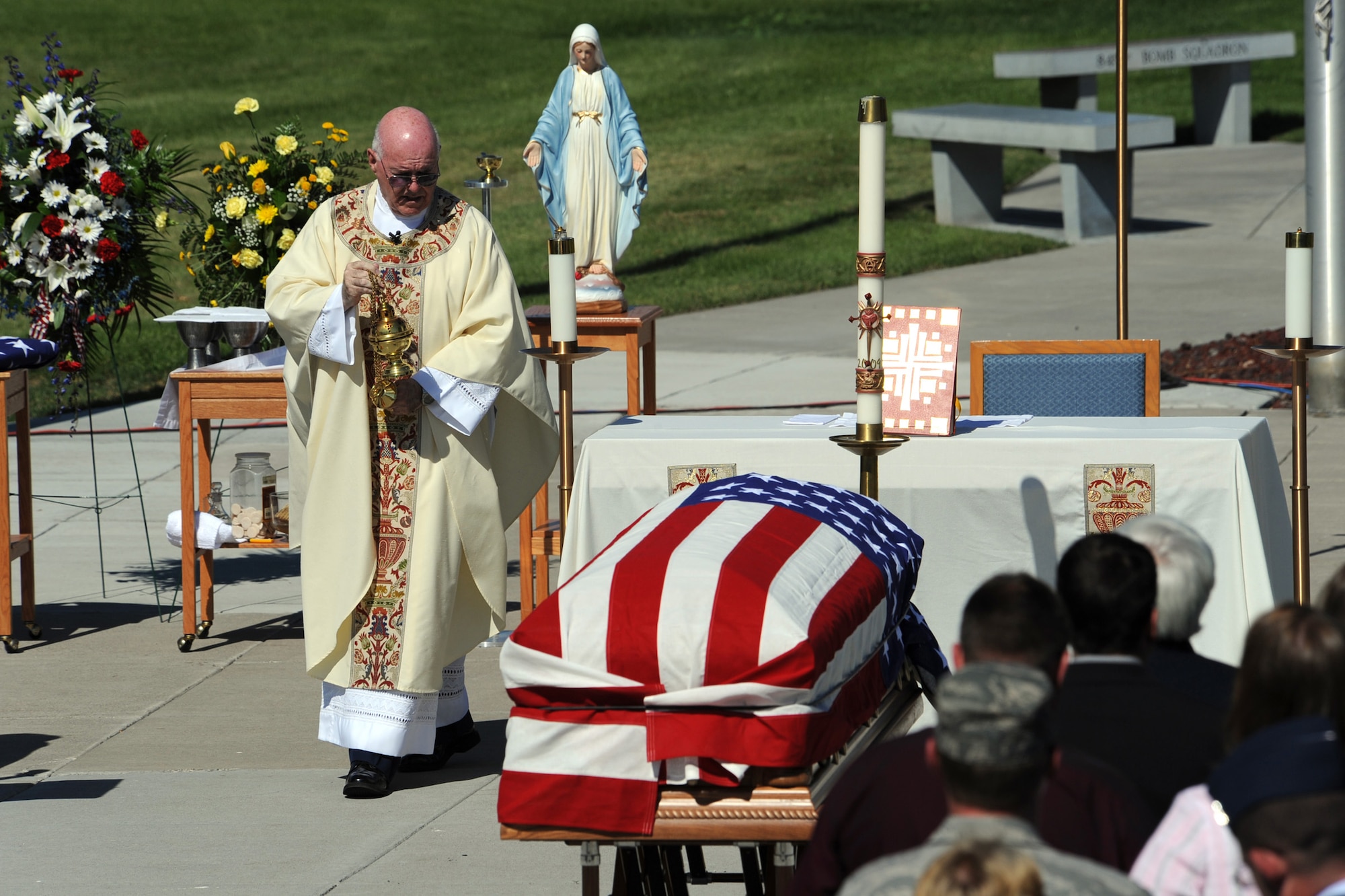 MOUNTAIN HOME AIR FORCE BASE, Idaho – Monsignor John J. Cusack, a catholic priest from Davis-Monthan AFB, Ariz., uses incense around the casket of Capt. Mark Zampogna, who died July 11 when he was removed from medical life support equipment during a memorial service at Holt Park July 17. The captain, from the 366th Operations Support Squadron, had been at St. Alphonsus Hospital in Boise, Idaho, in critical condition since July 6 after he was severely injured in a vehicle accident near McCall, Idaho. (U.S. Air Force photo by Master Sgt Timothy Cook)