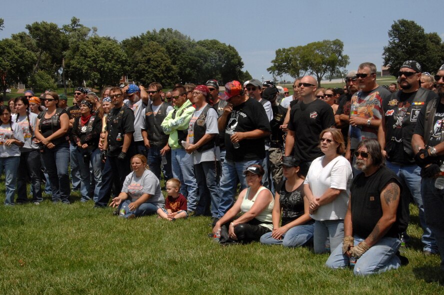 OFFUTT AIR FORCE BASE, Neb. -- Participants in the 7th Annual Yellow Ribbon Run gather at the Parade Ground to hear the history of the base, July 12. The Yellow Ribbon Run fund raiser proceeds are donated to the Friends of the Family Support Center located on Offutt.U.S. Air Force Photo by: Kendra Williams