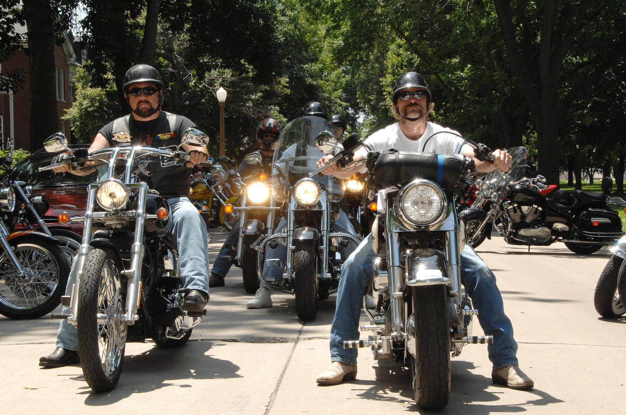 OFFUTT AIR FORCE BASE, Neb. -- Members of varioius motorcycle clubs prepare to exit Washington Square on the parade grounds enroute to the parking lot at the Martin Bomber Building for a group photo following their participation in the 7th Annual Yellow Ribbon Run July 12.  The Yellow ribbon Run raised more than $8000 for the Friends of the Family Support Center located on Offutt.

U.S. Air Force Photo By Dana P. Heard