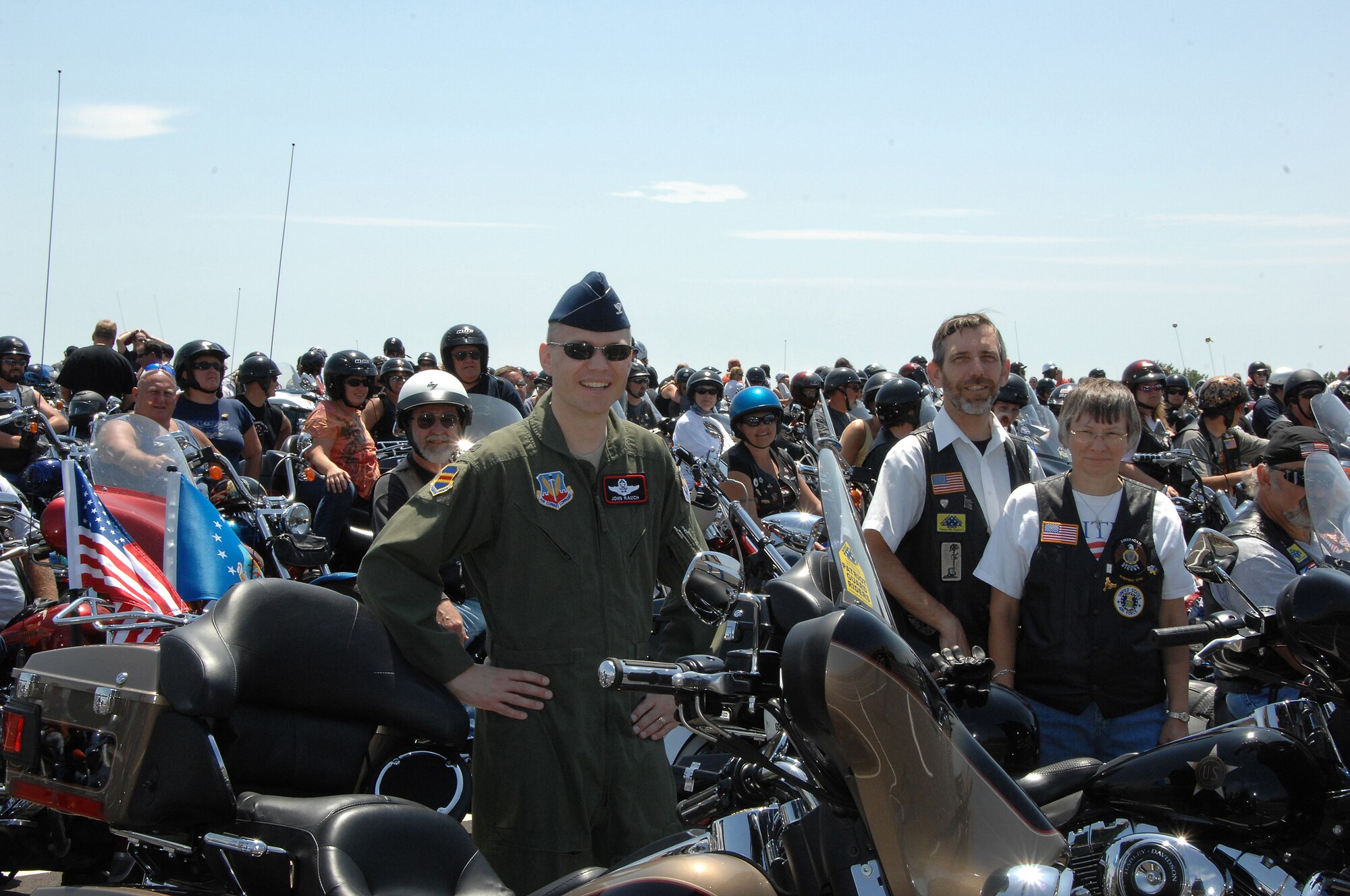 OFFUTT AIR FORCE BASE, Neb. -- Col. John T. Rauch, 55th Wing vice commander, poses for a group photo with members of various motorcycle clubs during the 7th Annual Yellow Ribbon Run July 12.  Riders from as far away as New Mexico participated in the fundraiser that raised more than $8000 for the Friends of the Family Support Center located on Offutt. 

U.S. Air Force Photo by Dana P. Heard