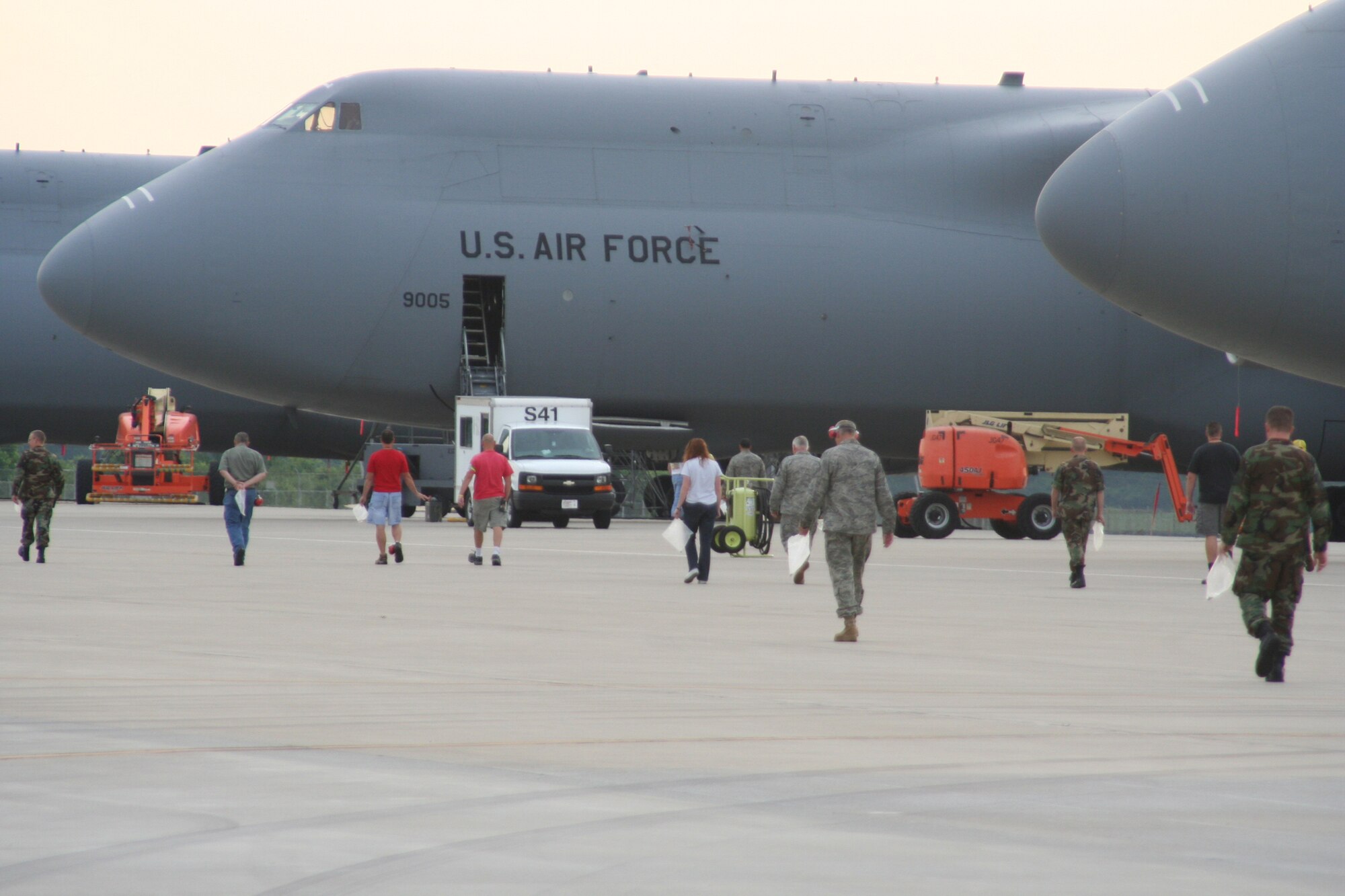 WRIGHT-PATTERSON AIR FORCE BASE, Ohio – More than 130 reservists and civilians from the 445th Airlift Wing participated in the bi-monthly foreign object debris (FOD) walk July 15.  FOD on the flightline could be ingested and severely damage aircraft engines.  More than four pounds of FOD was collected, which equates to several thousand small stones.  Chief Master Sgt. Darrell Cooper, 445th Aircraft Maintenance Squadron, discovered the “Golden Bolt” and received a certificate of achievement for FOD prevention and a gift certificate to a local restaurant. (Air Force photo/Stacy Vaughn)