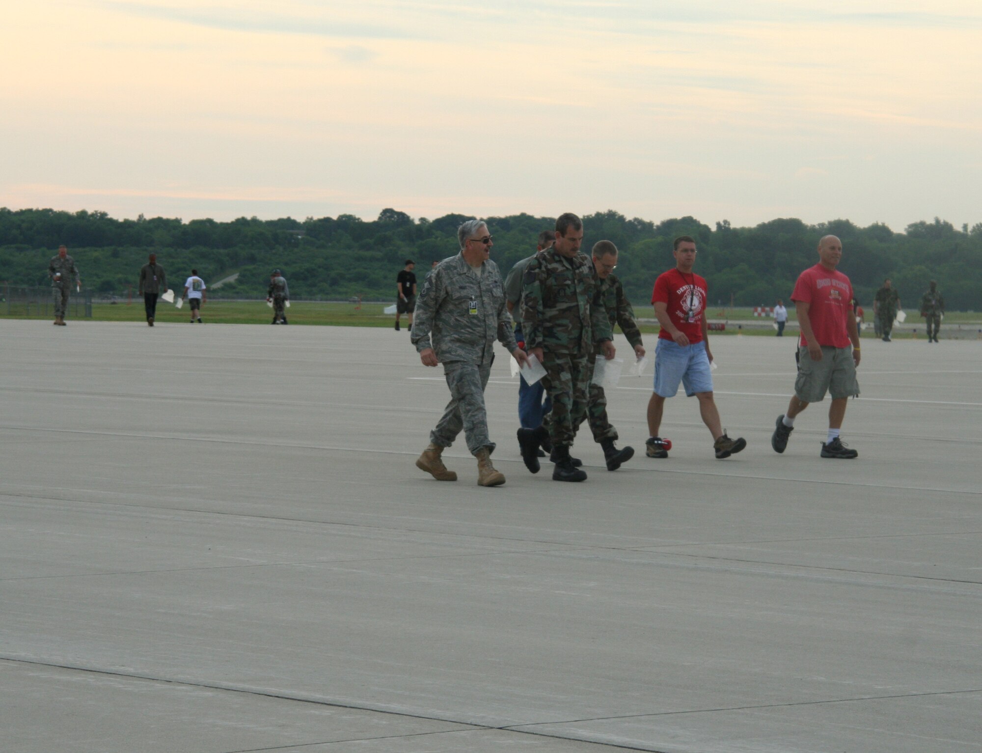 WRIGHT-PATTERSON AIR FORCE BASE, Ohio – More than 130 reservists and civilians from the 445th Airlift Wing participated in the bi-monthly foreign object debris (FOD) walk July 15.  FOD on the flightline could be ingested and severely damage aircraft engines.  More than four pounds of FOD was collected, which equates to several thousand small stones.  Chief Master Sgt. Darrell Cooper, 445th Aircraft Maintenance Squadron, discovered the “Golden Bolt” and received a certificate of achievement for FOD prevention and a gift certificate to a local restaurant. (Air Force photo/Stacy Vaughn)