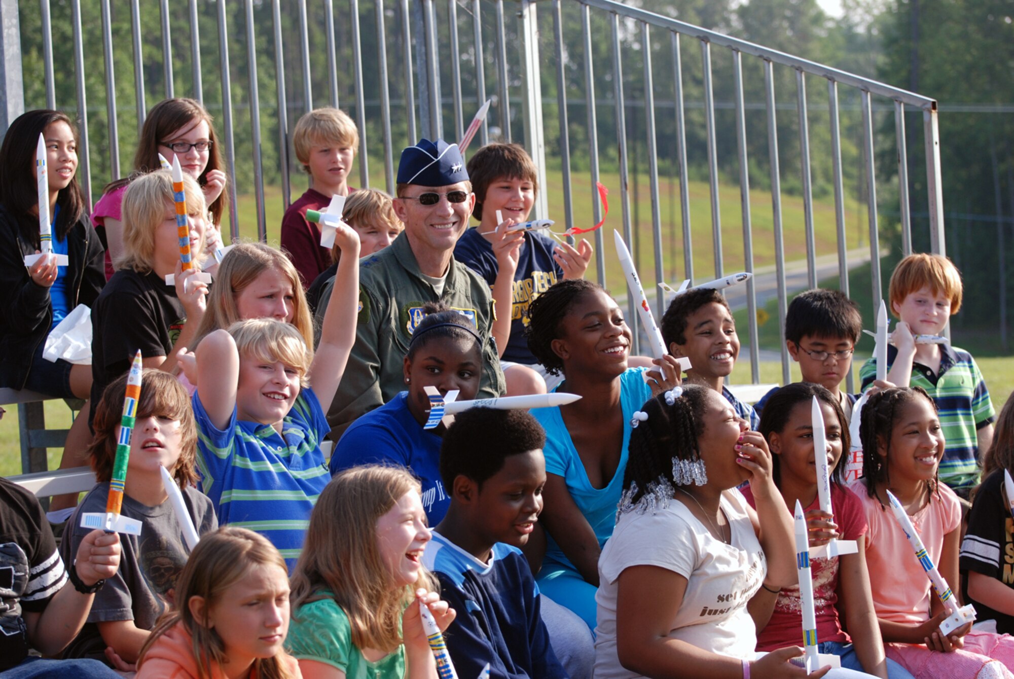 Maj. Gen. James T. Rubeor, 22 Air Force commander, watches children with the STARBASE summer camp launch rockets at Dobbins softball field July 16. The four-day program teaches children science, math, technology and aviation. (U.S. Air Force photo/Tech. Sgt. Bob Martin)