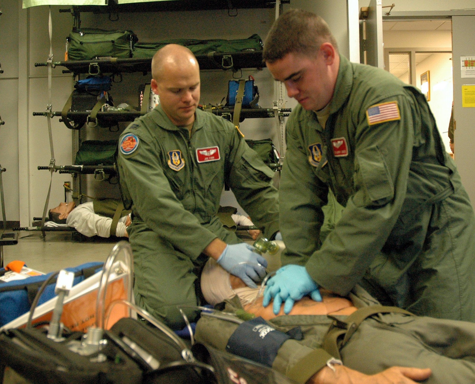 Capt. Joseph Foss, left, and Tech. Sgt. Larry Jones, both with the 446th Aeromedical Evacuation Squadron at McChord Air Force Base, Wash., practice cardiopulmonary resuscitation with bag-valve mask ventilations as part of in-flight patient care in preparation for the C-130 Hercules simulated contingency mission event in Rodeo 2009. Captain Foss and Sergeant Jones will be among more than 2,500 participants and 100 teams in the bi-annual Air Mobility Command Rodeo competition at McChord July 19-24. (U.S. Air Force photo/Tech. Sgt. Jake Chappelle)