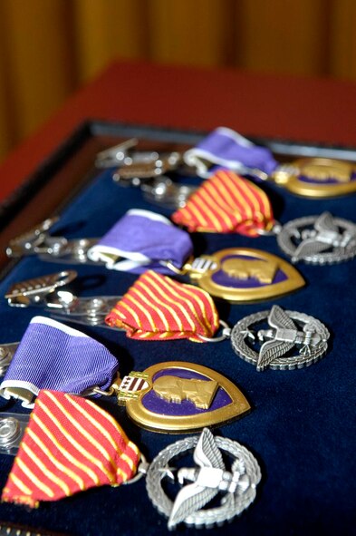 A row of Purple Heart and Combat Action medals lay at the ready for presentation to wounded Airmen at Walter Reed Army Medical Center, Washington D.C.  One of each were presented to Staff Sgt. David Flowers, 2d Civil Engineer Squadron, as well as a Bronze Star for his selfless service and actions during his recently deployment to Bagram Air Base, Afghanistan.  (U.S. Air Force photo by Staff Sgt. Sarah E. Stegman) (RELEASED)