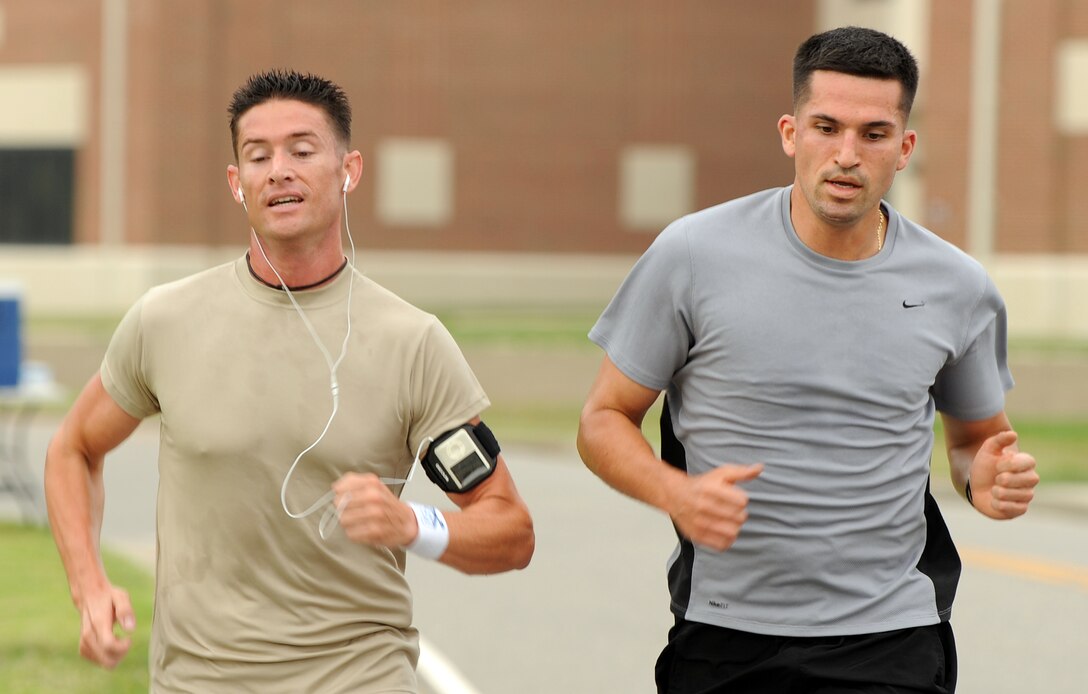 LANGLEY AIR FORCE BASE, Va. -- First Lt. Brandon Bryan, 1st Logistic Readiness Squadron fuels commander, and Capt. Elias Guerra, Air Combat Command protocol, race to the finish of the Run for the Rocker 5K here July 17. More than 50 participants signed up and ran in the event. (U.S. Air Force photo/Airman 1st Class Jonathan Koob)
