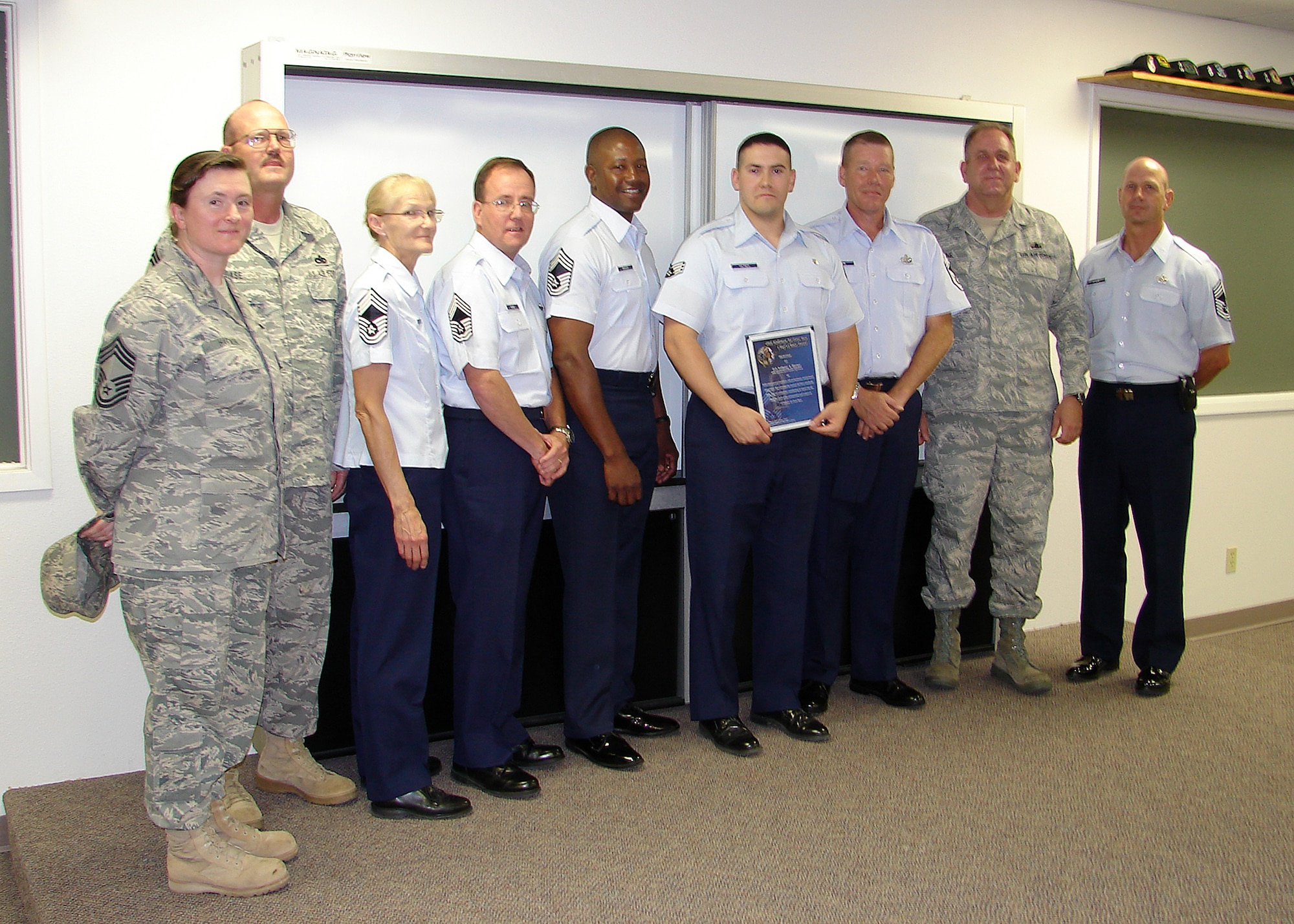 Senior Airman Anthony Hayner, 49th Aeromedical Dental squadron recieves the Chief's Choice award, June 22, at Holloman Air Force Base, N.M. The selection criteria usually is Staff Sergeant or below, be assigned to Holloman AFB and set the example all others should follow. (Courtesy photo)