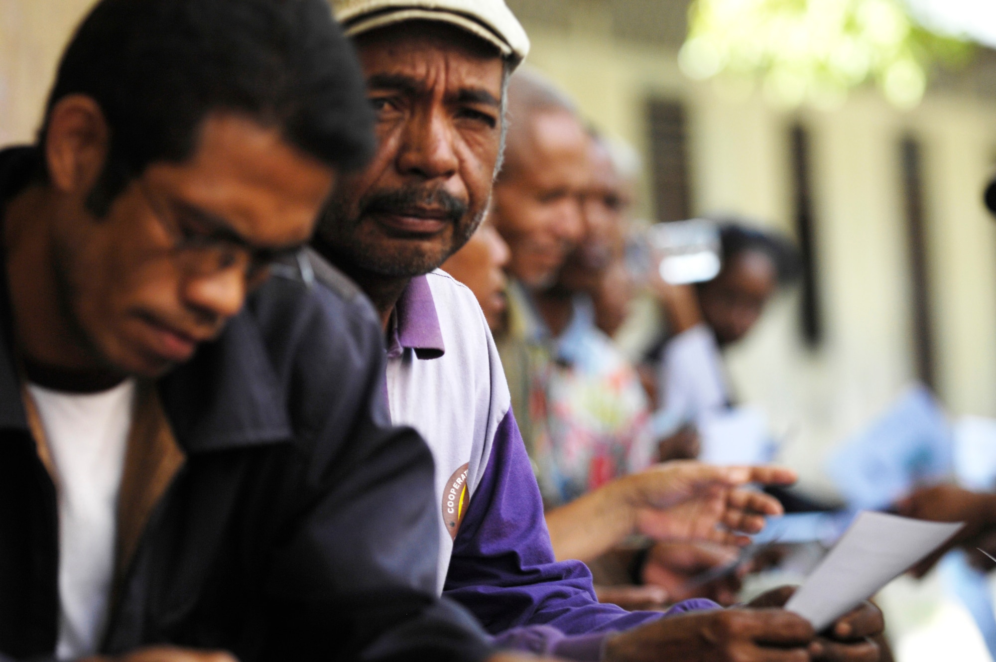 An East Timorese man waits outside a makeshift optometry office for a free exam at a clinic set up July 16 in Dili, Timor Leste. More than 300 people were seen on the first of four days at the clinic. East Timorese and U.S. officials set up the clinic as part of Operation Pacific Angel 2009, a Pacific Air Forces humanitarian assistance operation led by 13th Air Force at Hickam Air Force Base, Hawaii. (U.S. Air Force photo/Tech. Sgt. Cohen A. Young)