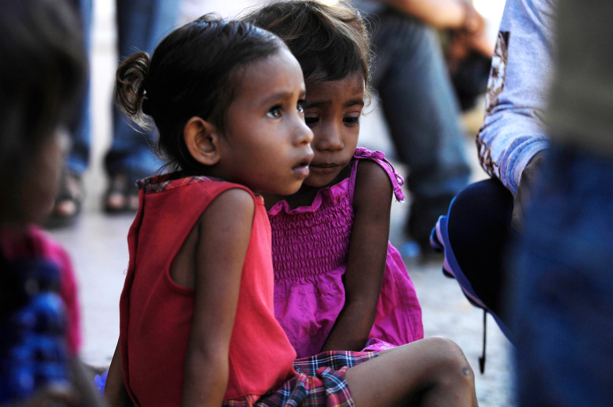 Two East Timorese girls wait to be seen by a U.S. Air Force family care physician while at a clinic July 16 in Dili, Timor Leste. More than 300 people were seen on the first of four days at the clinic. East Timorese and U.S. officials set up the clinic as part of Operation Pacific Angel 2009, a Pacific Air Forces humanitarian assistance operation led by 13th Air Force at Hickam Air Force Base, Hawaii. (U.S. Air Force photo/Tech. Sgt. Cohen A. Young) 