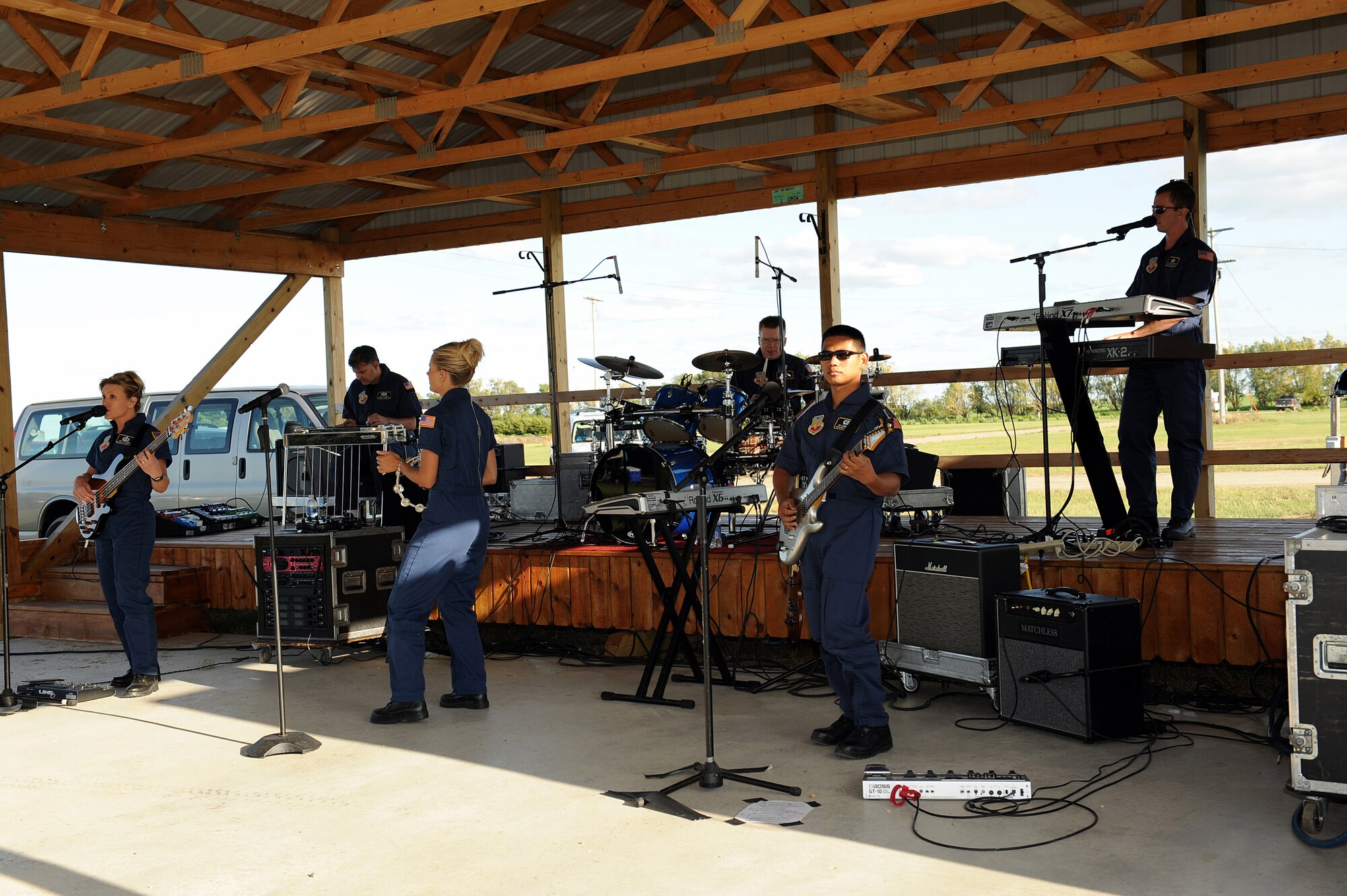 MOHALL, N.D. -- Members of Night Wing perform during a concert in here July 15. Night Wing is the country/rock showcase group of the United States Air Force Heartland of America Band. Night Wing inspires audiences to increased patriotism through their unique vocal blend and amazing musicianship while raising awareness of our expeditionary Airmen serving around the globe. (U.S. Air Force photo by Tech. Sgt. Linda C. Miller)