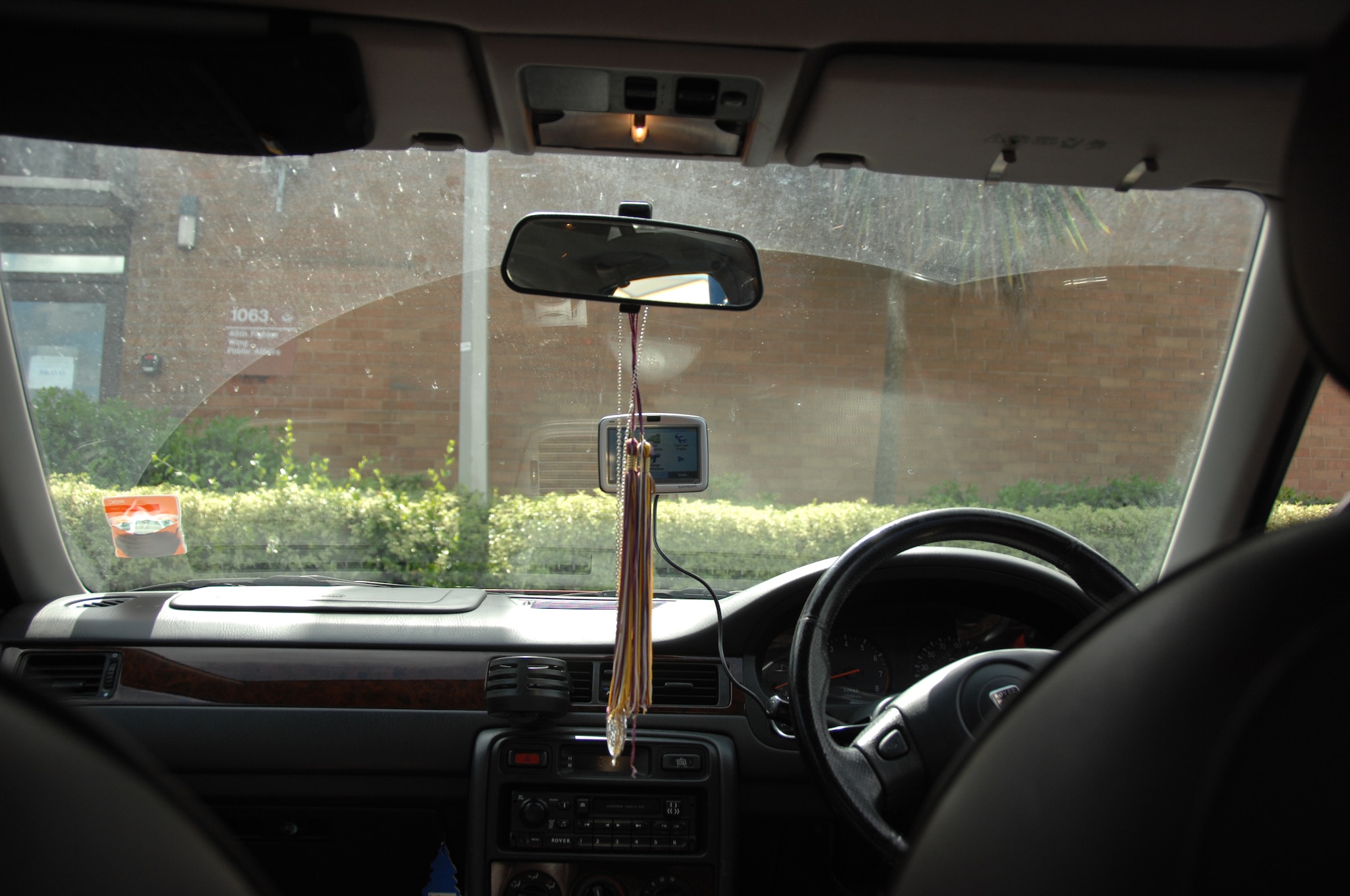 A window showing examples of items that will be a markdown during an MOT inspection here, July 1, 2009. Items are not allowed to be hung off the rear view mirror or they will be a write-up. (U.S. Air Force photo/TSgt. Christopher A. Campbell)