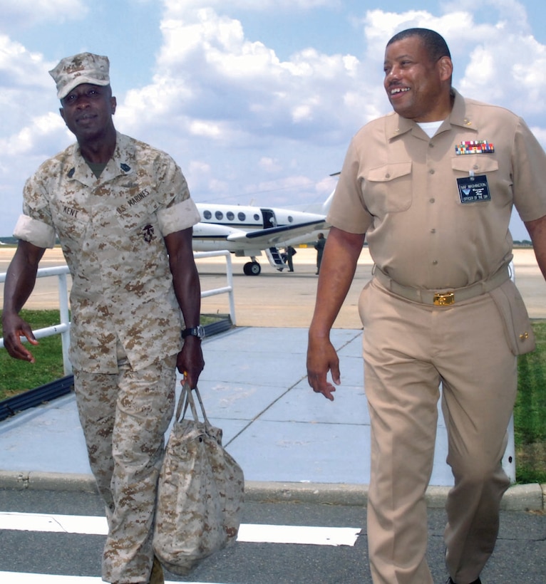 Navy Chief Petty Officer Larry Suber, right, Naval Air Facility Washington Officer of the Day, escorts Sergeant Maj. Carlton W. King, Sergeant Major of the Marine Corps as he transits through NAF Washington Friday. (U.S. Air Force photo/ Bobby Jones)