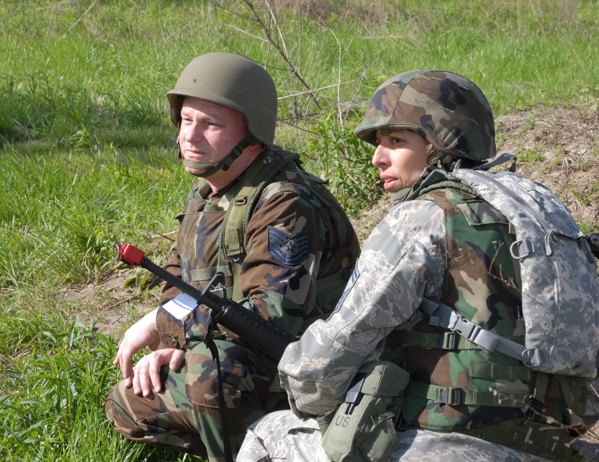 Command Chief Master Sgt. Sandra Santos (right) watches the horizon for anything out of the ordinary during a weekend drill at the 932nd Airlift Wing.  Classroom training and field events keep members sharp.  Chief Santos is holding a special enlisted call during the July unit training assembly to take questions and answers from fellow Airmen.  (U.S. Air Force photo/Maj. Stan Paregien)