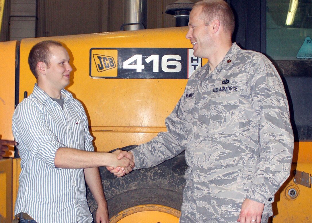 GRISSOM AIR RESERVE BASE, Ind., -- Maj. Paul Brenner, 434th Civil Engineer Squadron commander, greets Senior Airmen Zack Loich, a 434th CES Heavy Equipment Operator, that was inprocessing into the unit. (Air Force photo/Staff Sgt. Ben Mota)