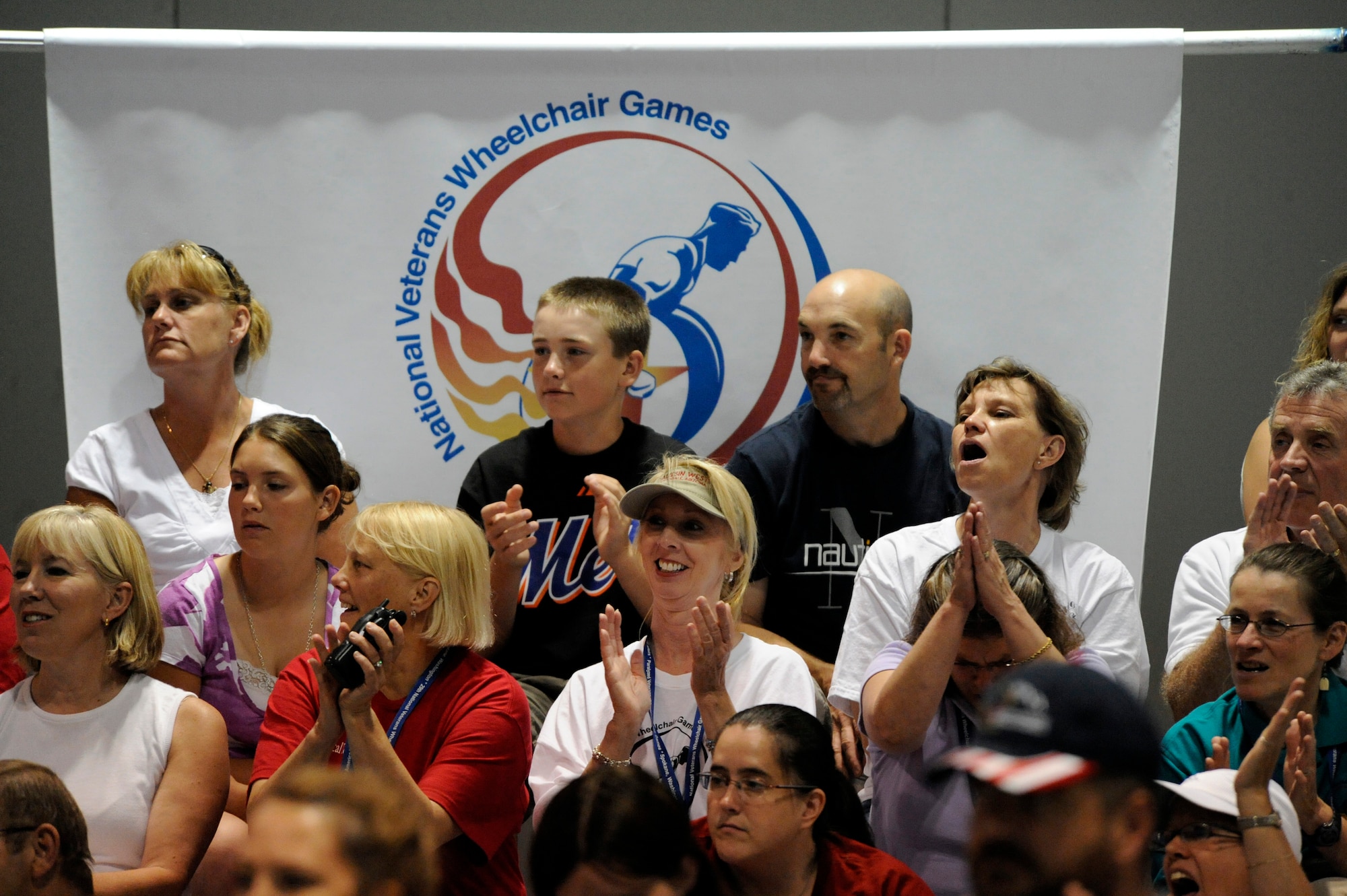 Volunteers and fans cheer during the slalom super G competition of the 29th National Veterans Wheelchair Games July 16 in Spokane, Wash. Volunteers play an important role in the games and come from all over the United States to help out. (U.S. Air Force photo/Staff Sgt. Desiree N. Palacios)