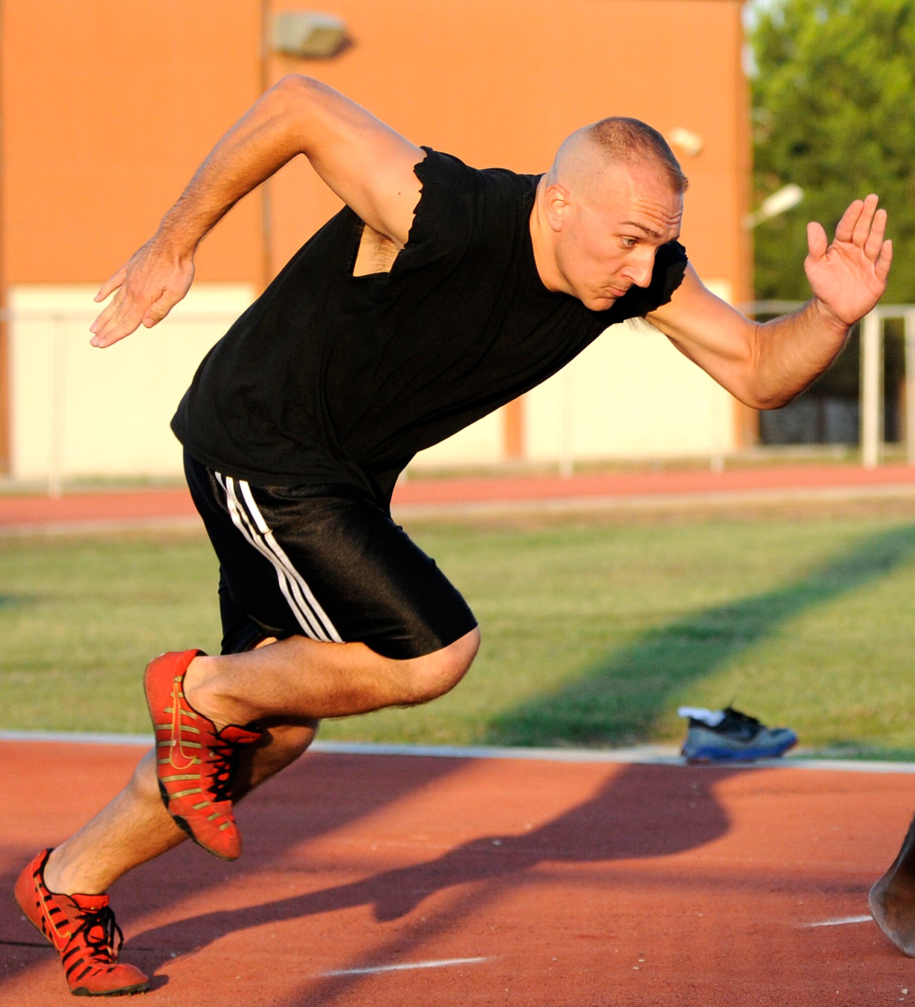 Staff Sgt. Michael Kohut, 39th Communications Squadron, bursts from the starting line of the 100 meter race Wednesday, 25 July 2009 during the Under the Lights Track Meet at Incirlik Air Base, Turkey. The event was sponsored by the Health and Wellness Center, the Sexual Assault Response Coordinator and the Fitness Center to promote fitness and increase base morale. Squadrons earned points throughout the event to determine the winner of the Travelling Unit Fitness Award. The winning squadron was the 728th Air Mobility Squadron. (U.S. Air Force photo/ Staff Sgt. Raymond Hoy)