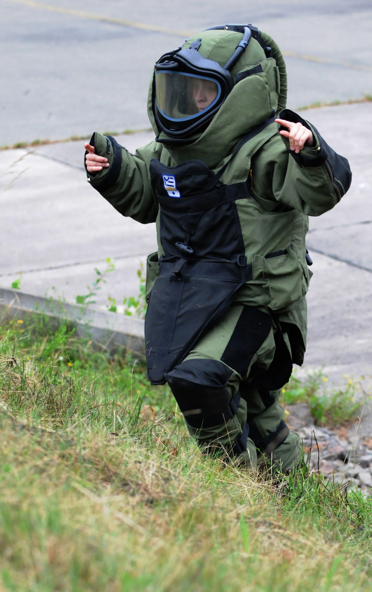 British Air Cadet, Cpl. Charlotte Bennetts native of Newcastle, England, climbs a hill in an explosive ordnance disposal bomb-suit that weighs approximately 75 lbs. during the cadets' visit to Ramstein Air Base, Germany, July 14, 2009. The cadets visited Ramstein for a week of leadership development and contingency skills training. (U.S. Air Force photo by Senior Airman Nathan Lipscomb)