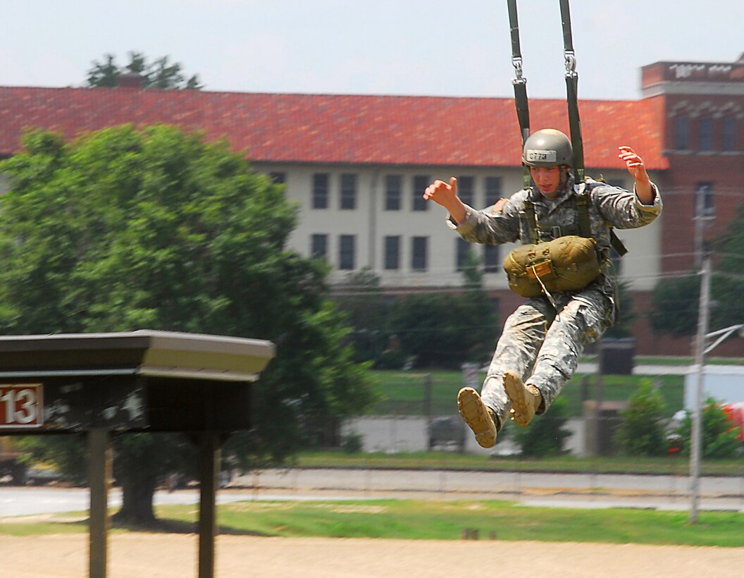 A soldier swings through the air after jumping from the 34foot tower