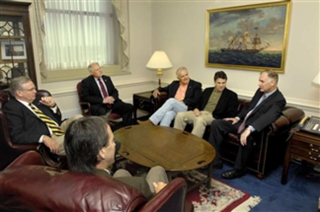 Deputy Secretary of Defense William Lynn (right) meets with a group of five state governors in his Pentagon office on July 17, 2009.  The governors will be traveling to Iraq to visit with deployed National Guard troops from their respective states.  The governors are Rick Perry of Texas (2nd from right), Jim Gibbons of Nevada (3rd from right), Patrick Quinn of Illinois (4th from right), Jay Nixon of Missouri (left) and Tim Pawlenty of Minnesota (2nd from left).  
